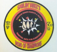 Smilin’ Mike’s Dojo of Champions logo
