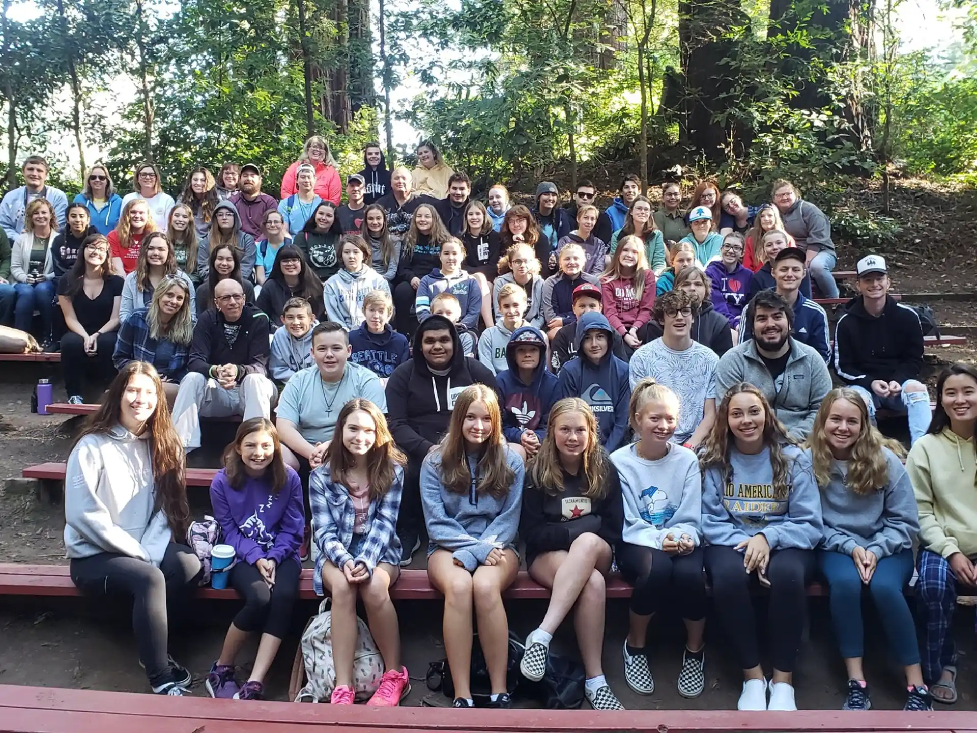 a group of people sitting on a bench