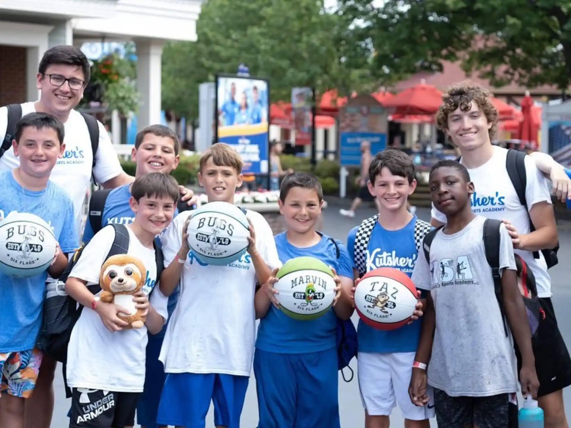 a group of people holding frisbees
