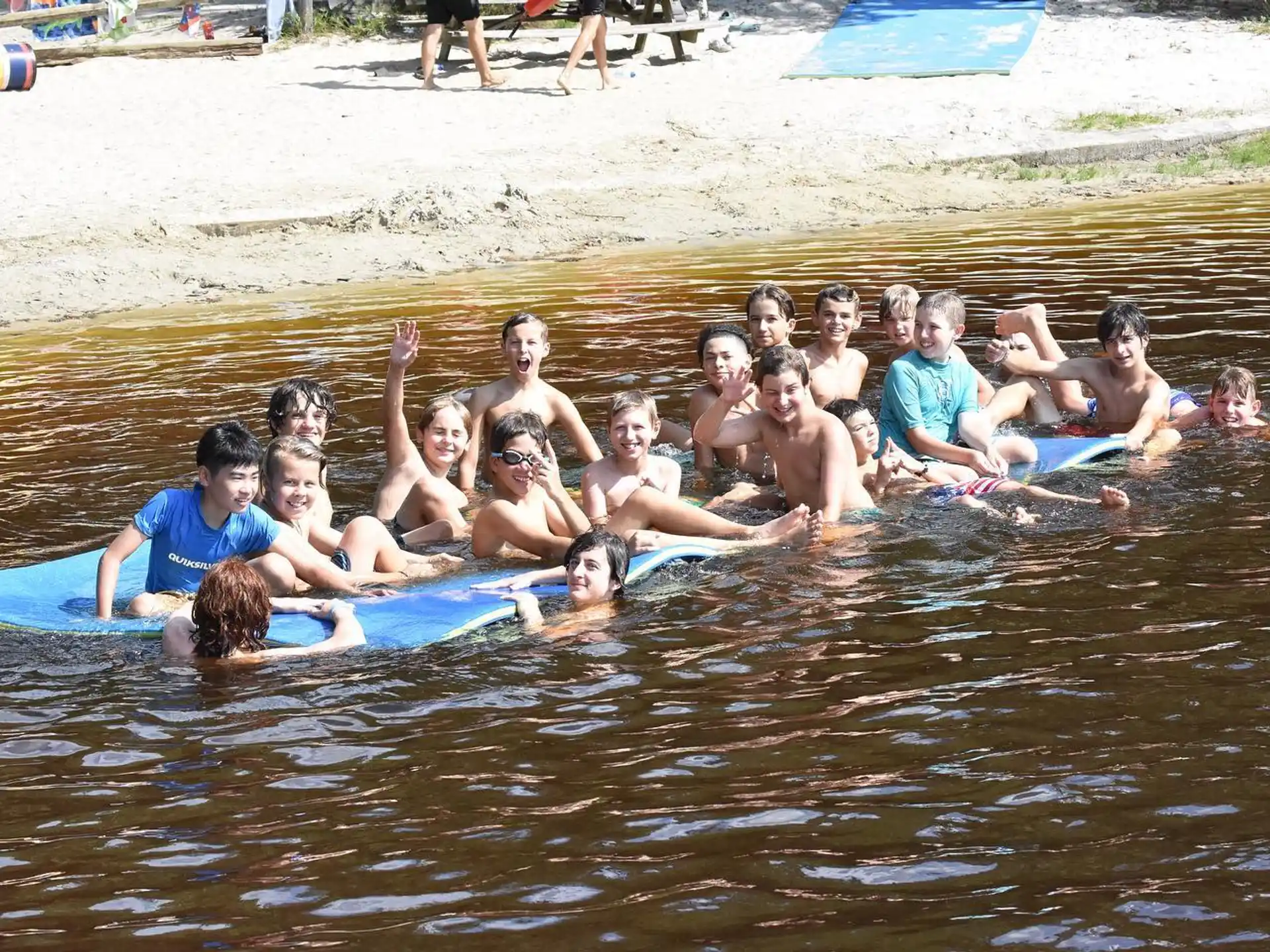 a group of people on surfboards