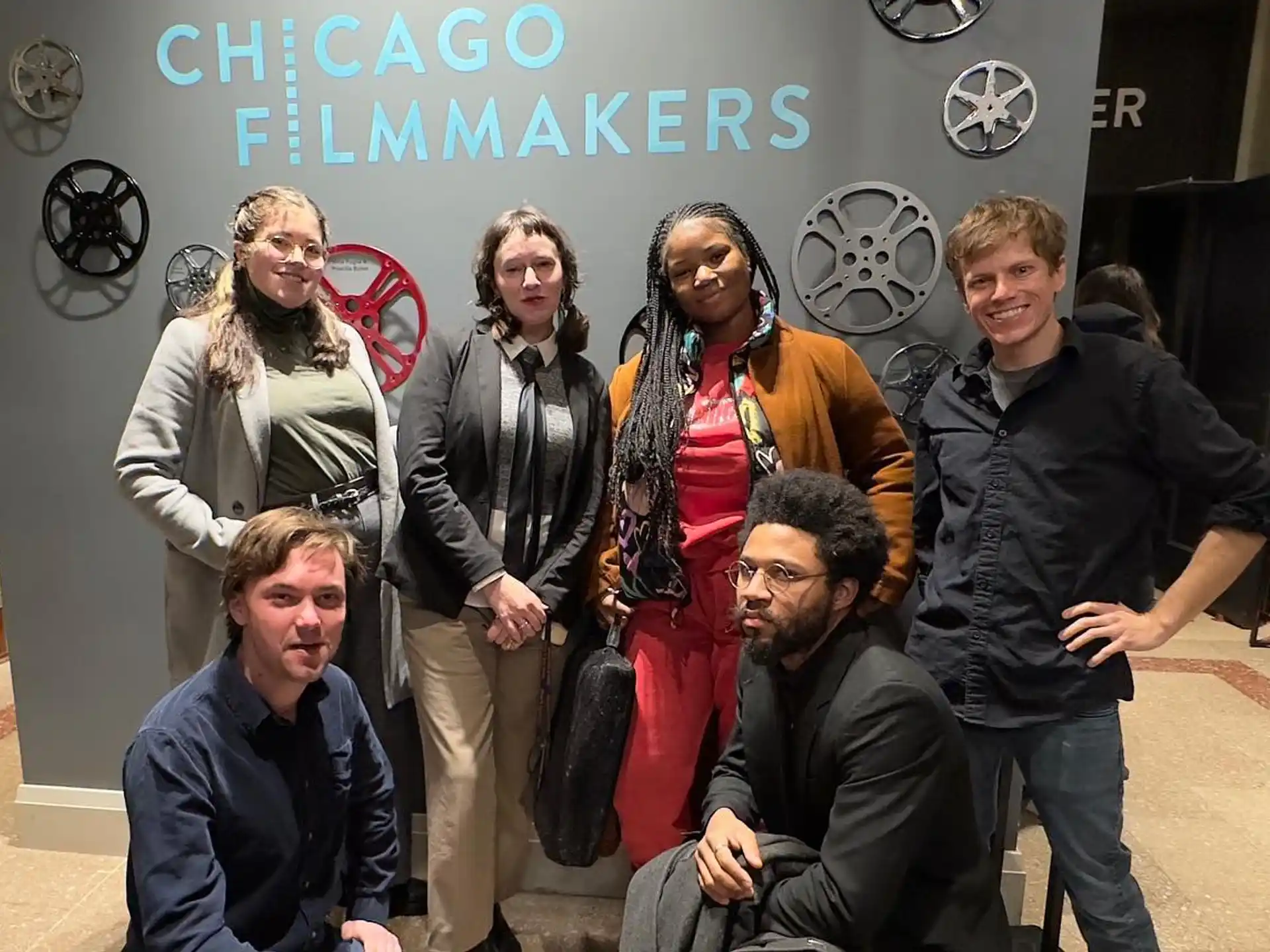 a group of people posing for a photo
