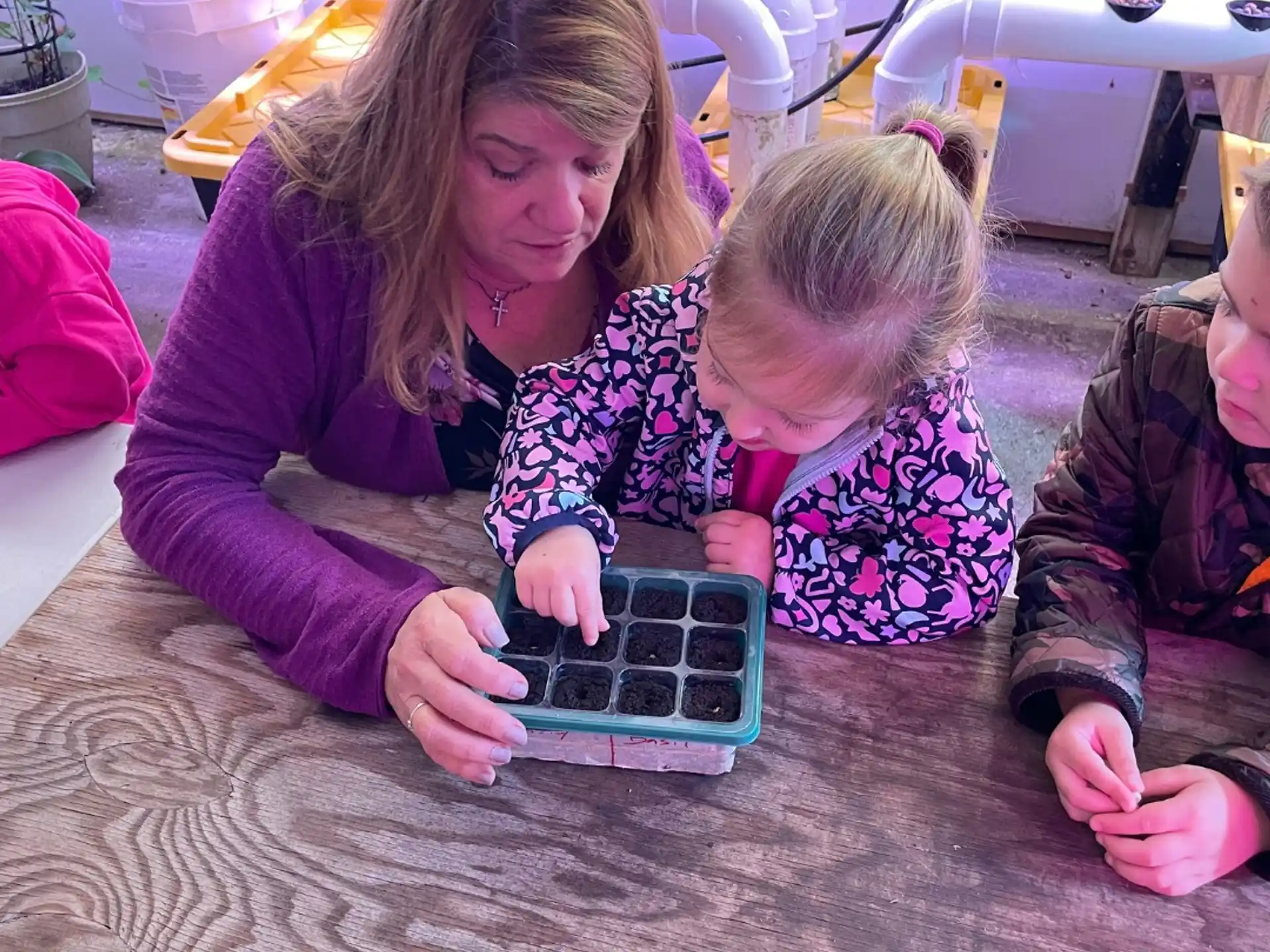 a person and a child playing with a toy