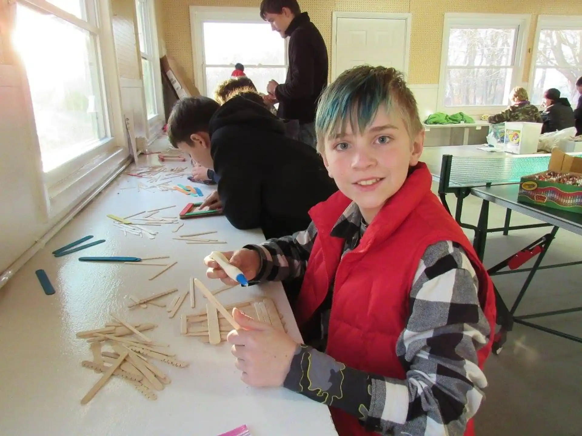 a boy sitting at a table