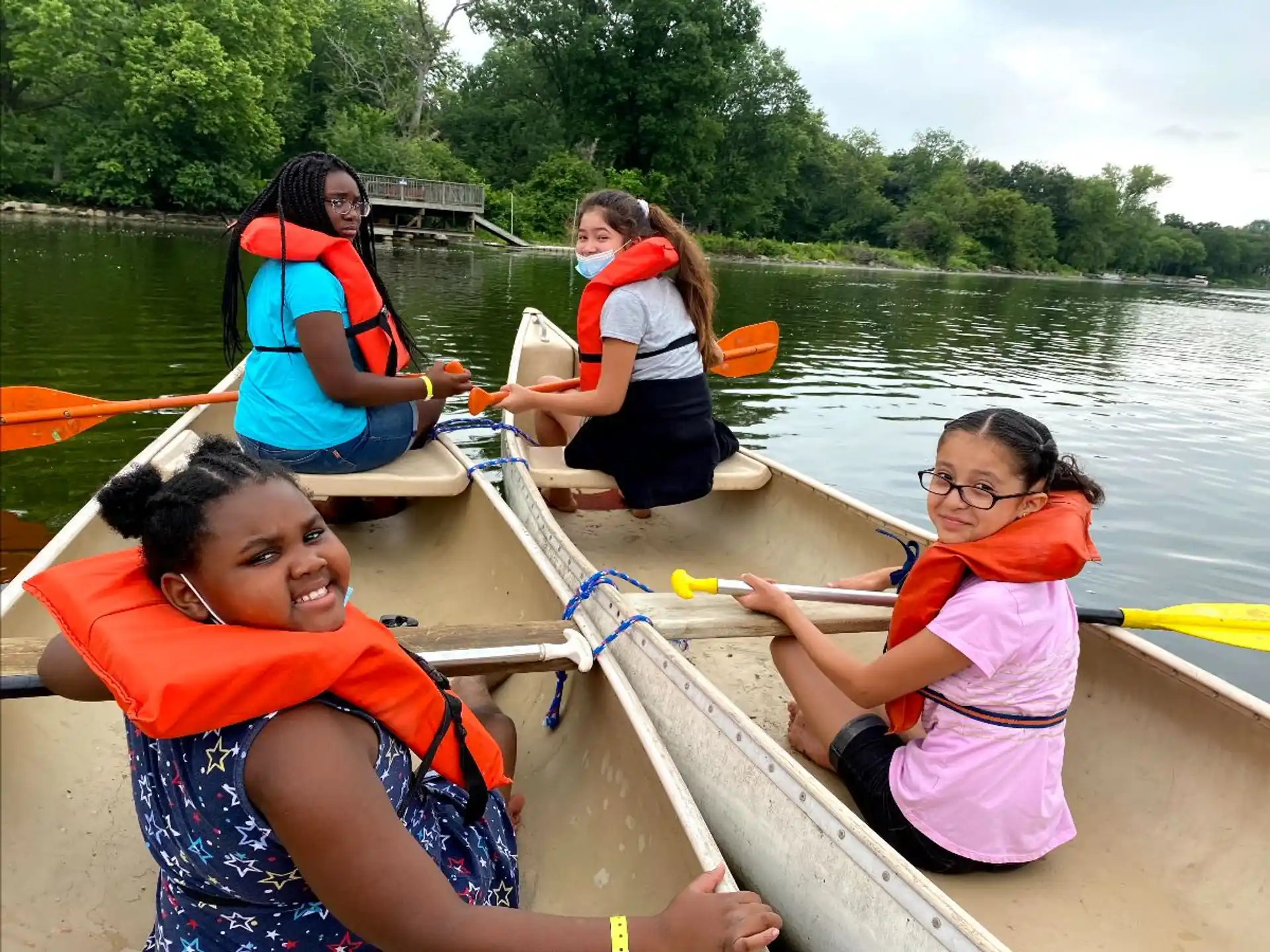 a group of people in a canoe