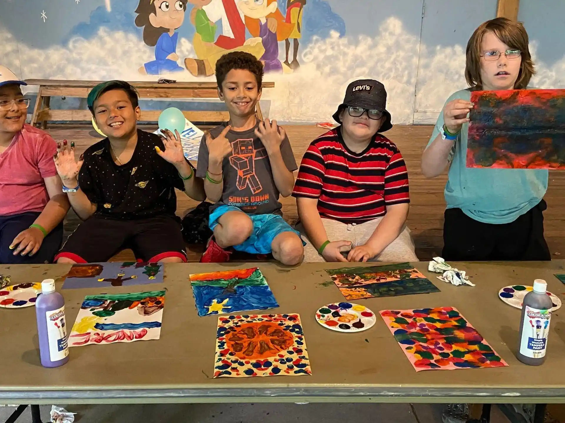 a group of people sitting at a table with a board game