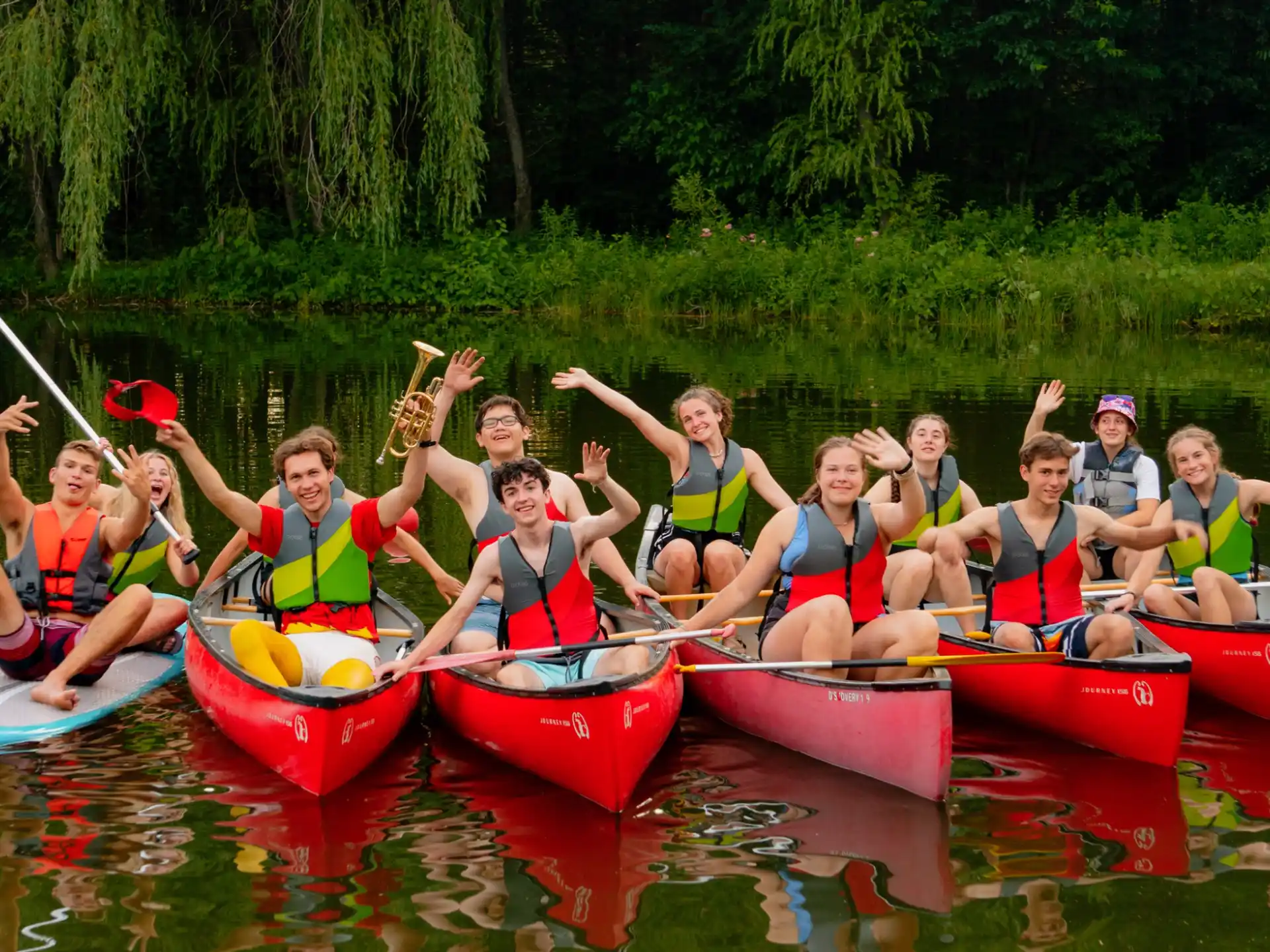 a group of people in canoes