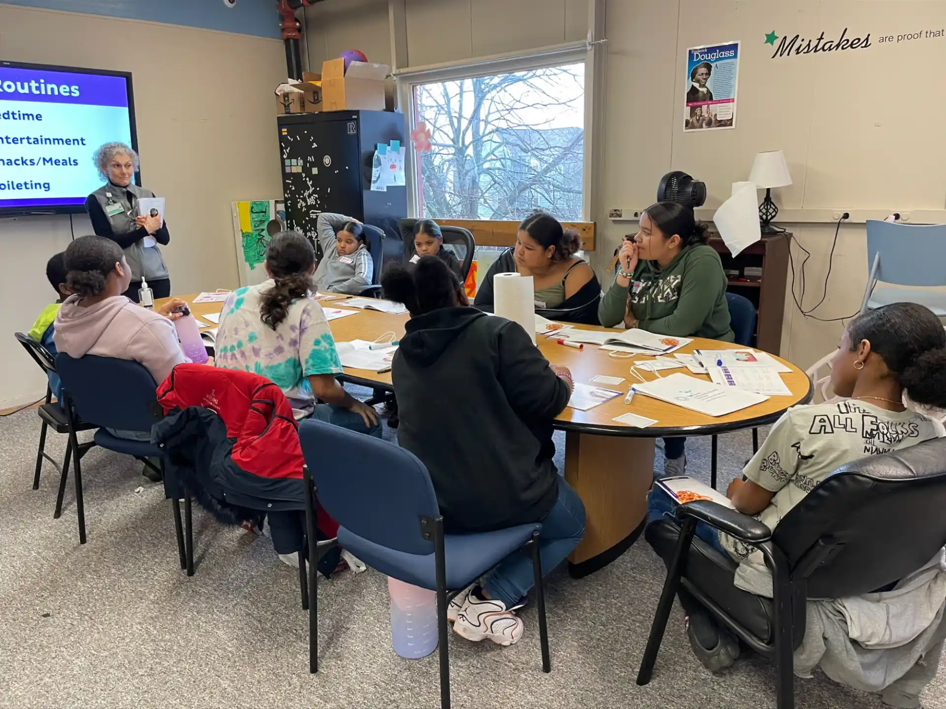 a group of people sitting around a table