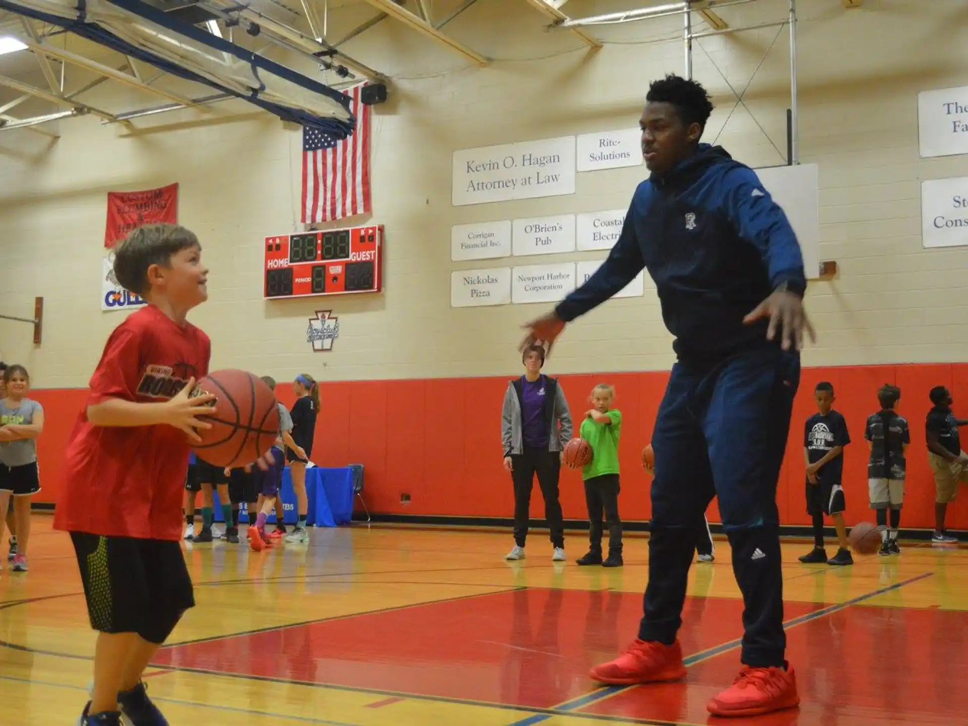 a person holding a basketball and a boy holding a basketball