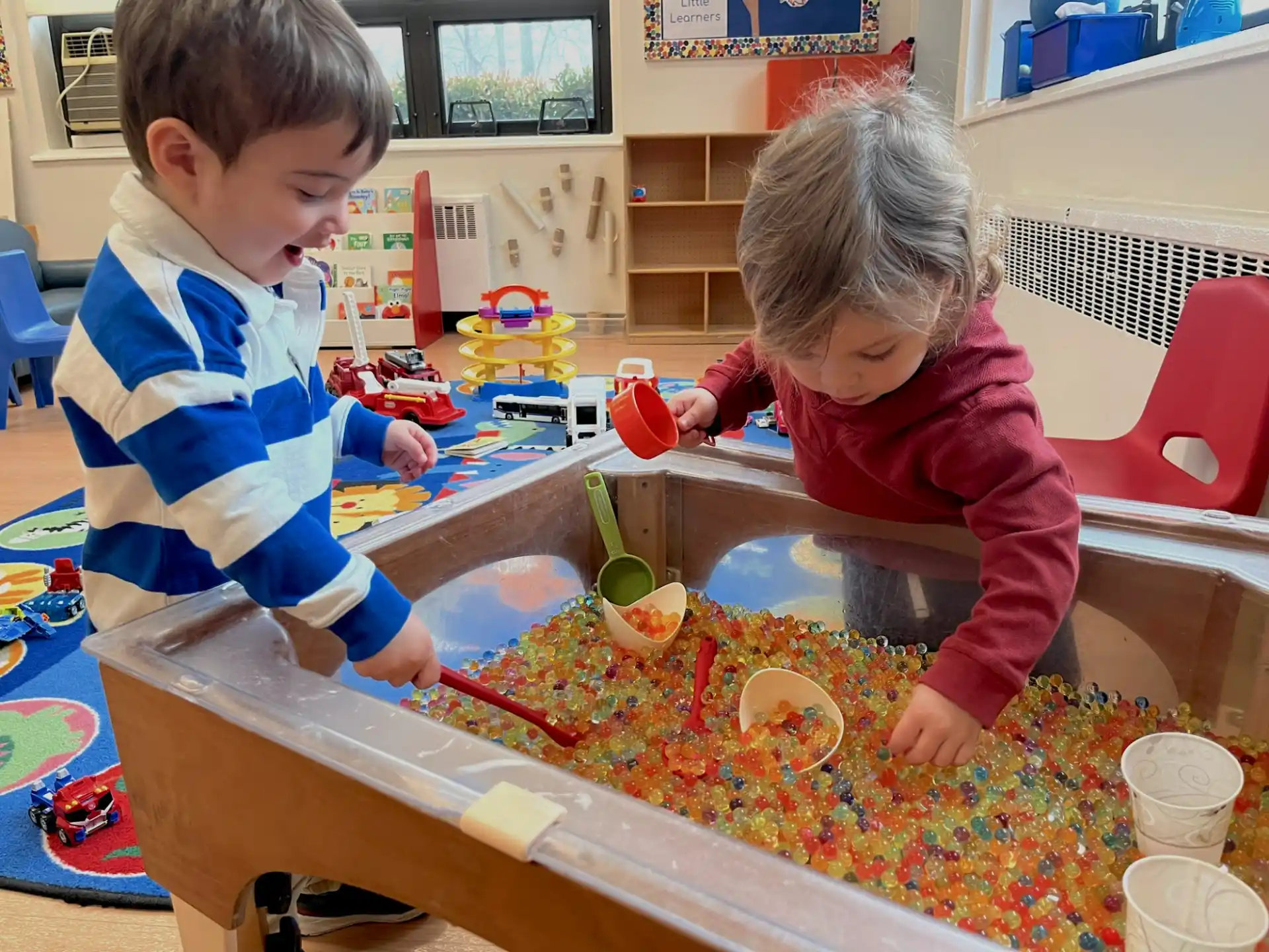 a couple of children playing with toys