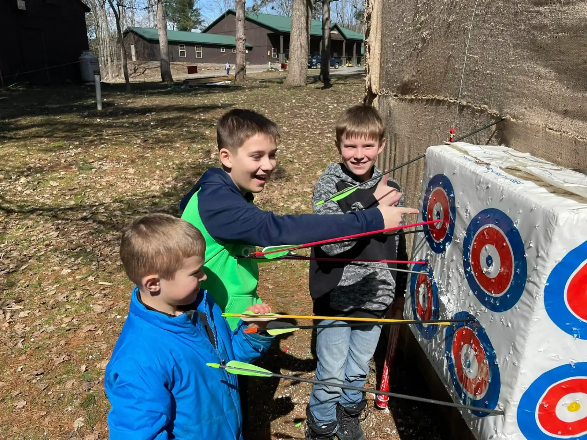 a group of boys playing with a toy
