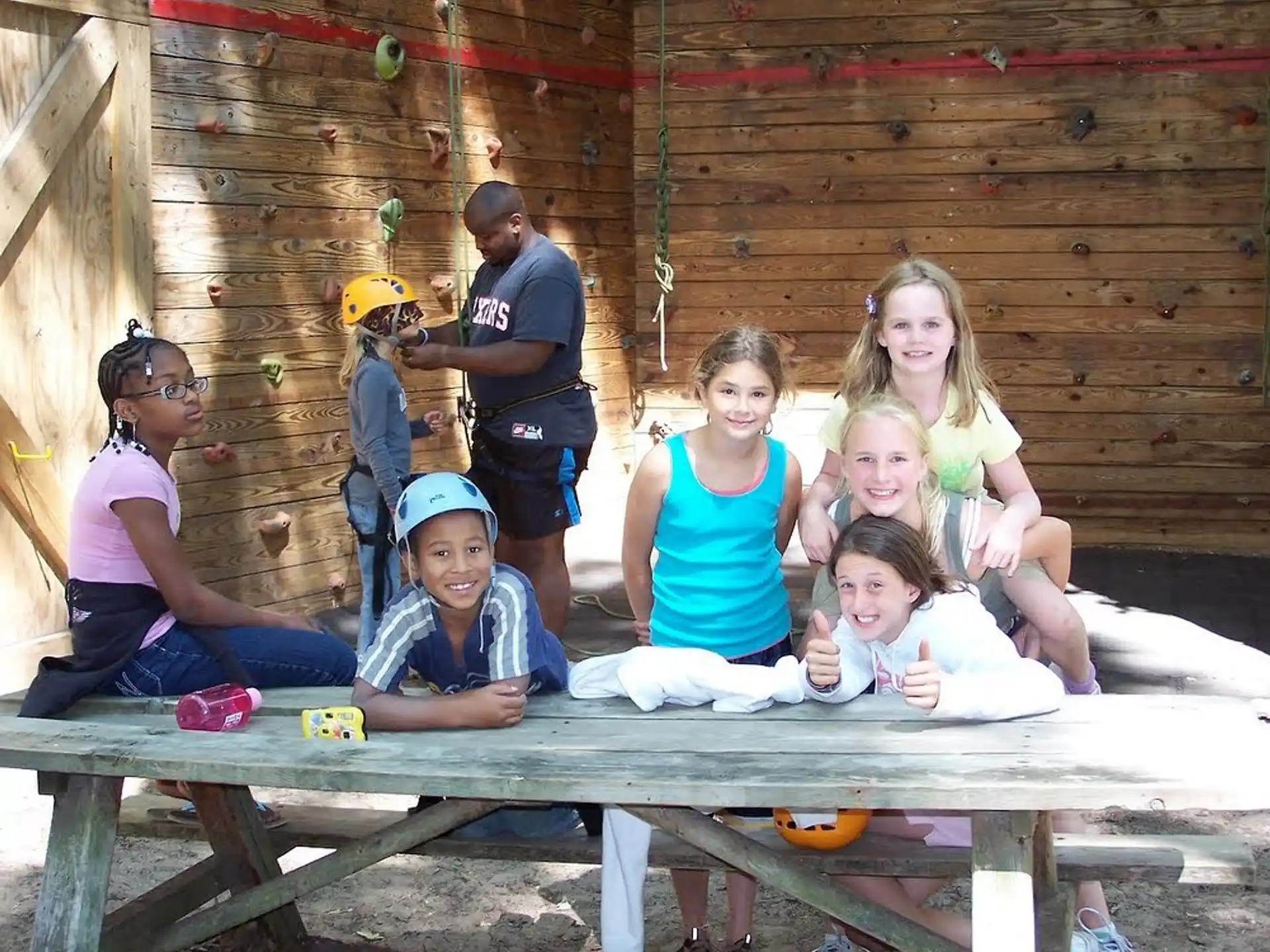 a group of kids sitting on a bench