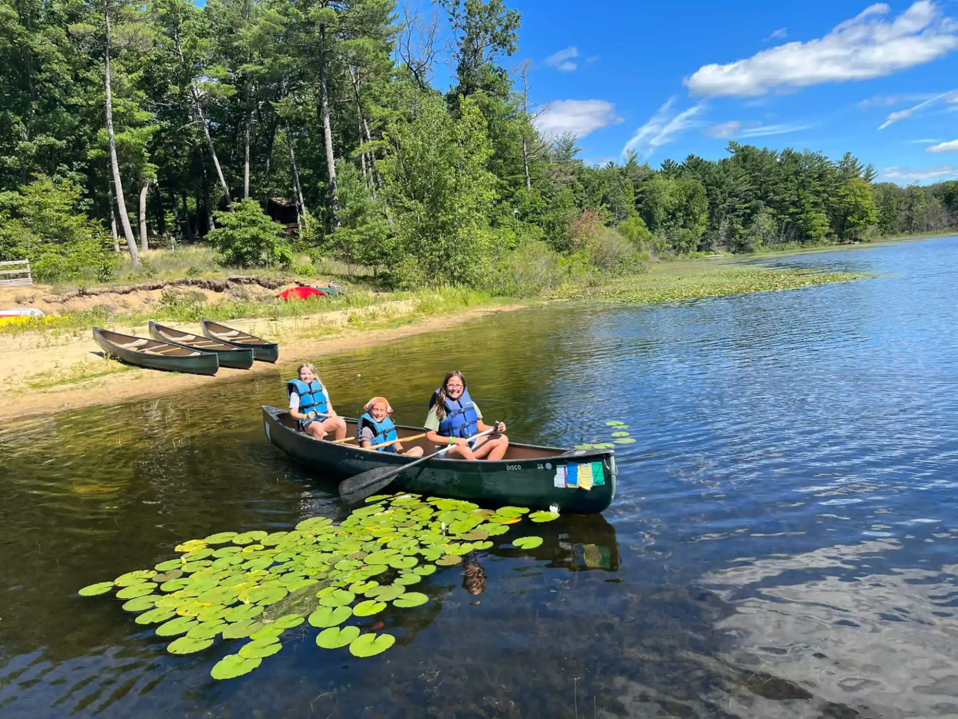 a group of people in a canoe on a river