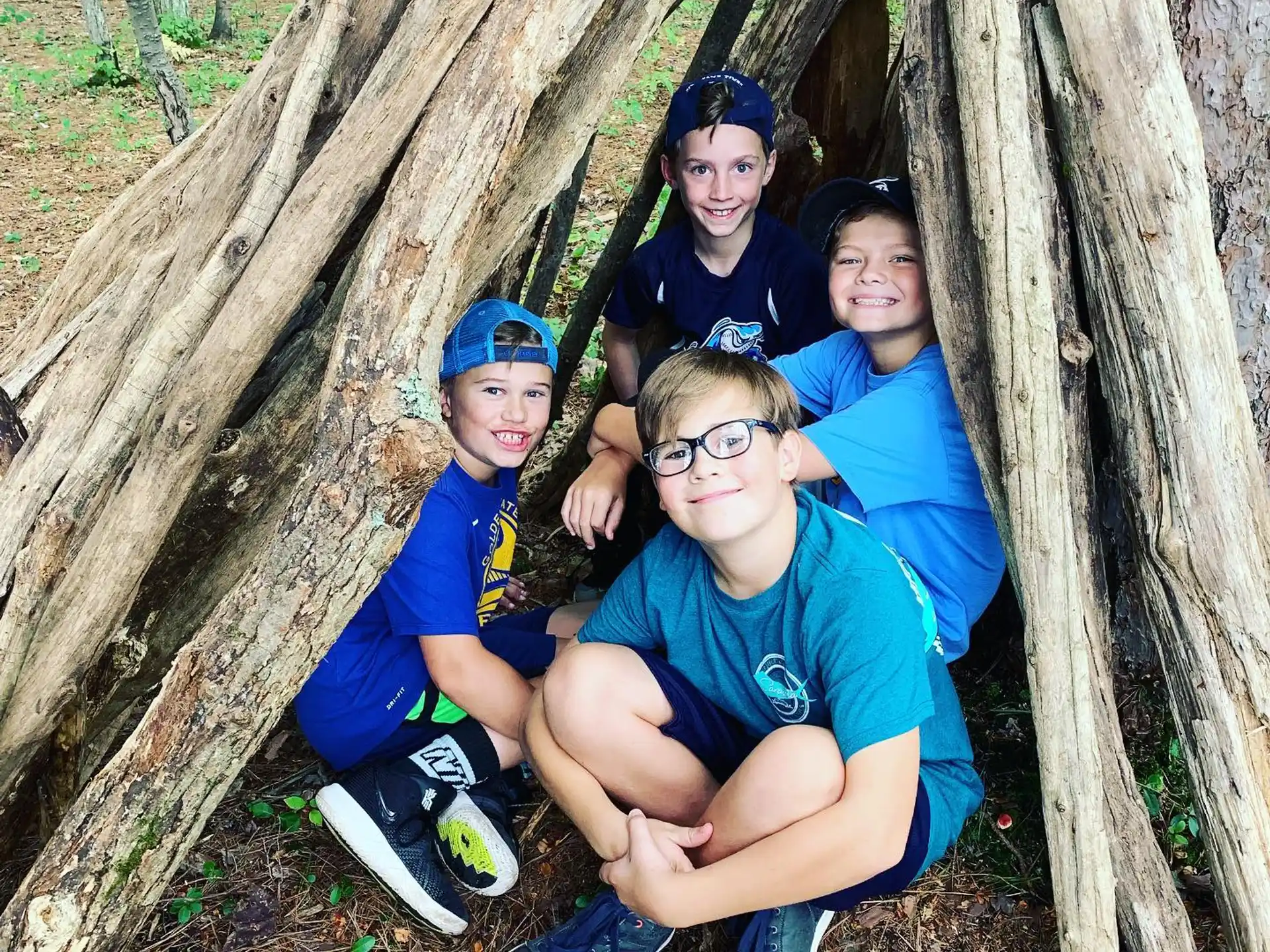 a group of people sitting in a tree