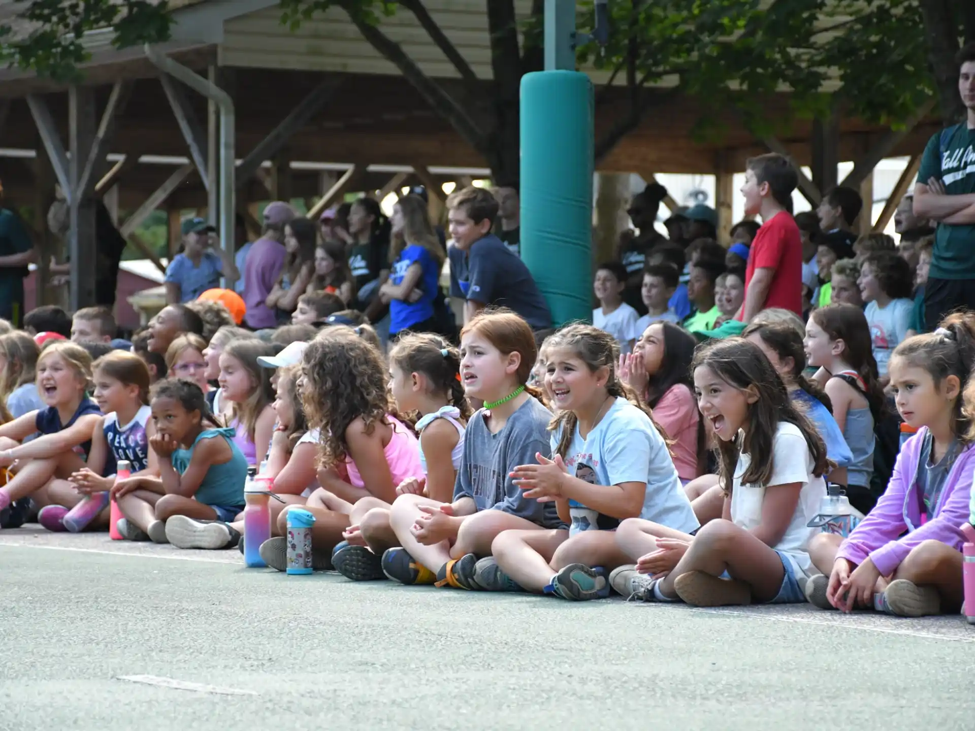 a group of children sitting on the ground