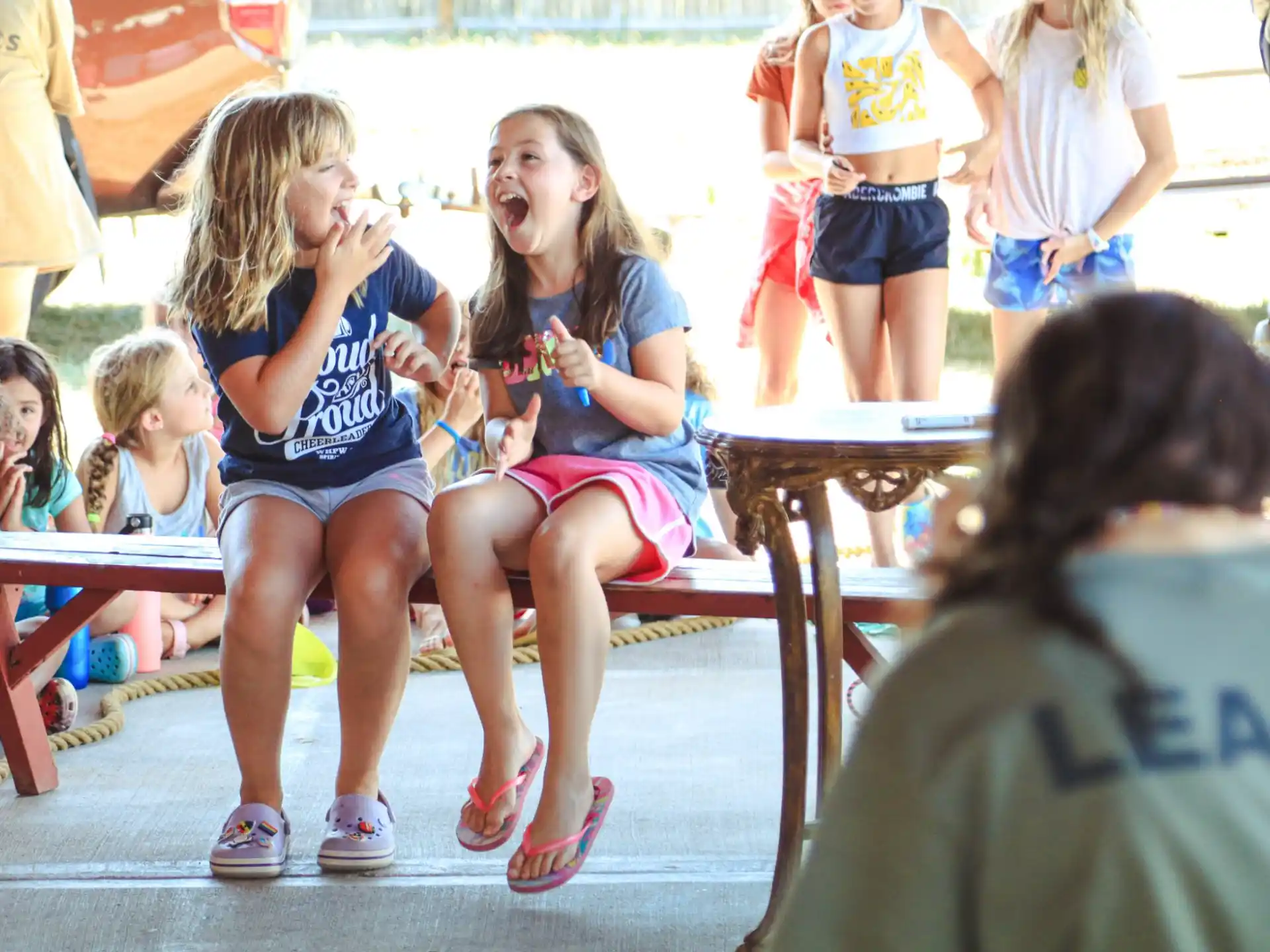 a group of children sitting on a bench