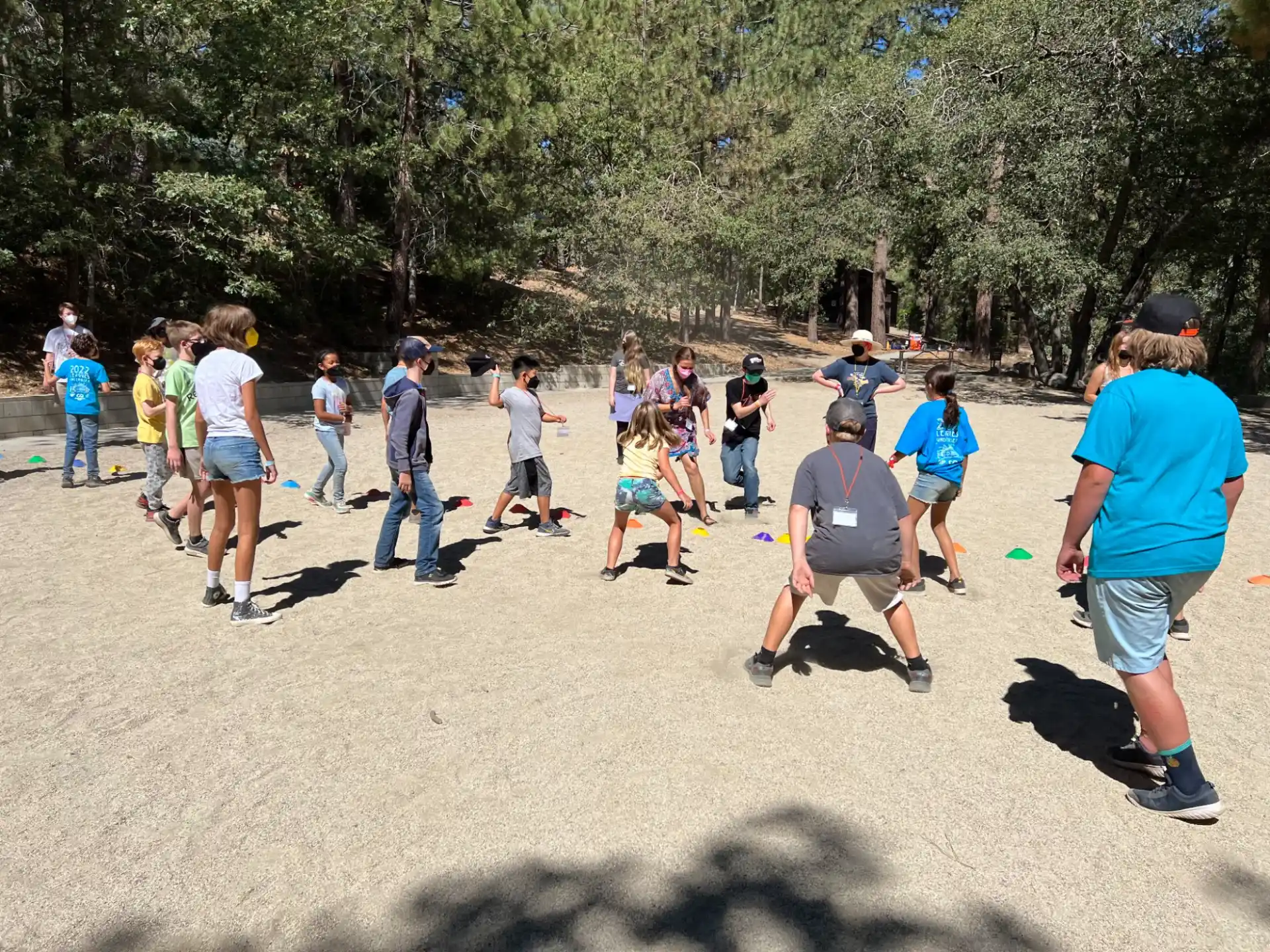 a group of people playing frisbee in a park