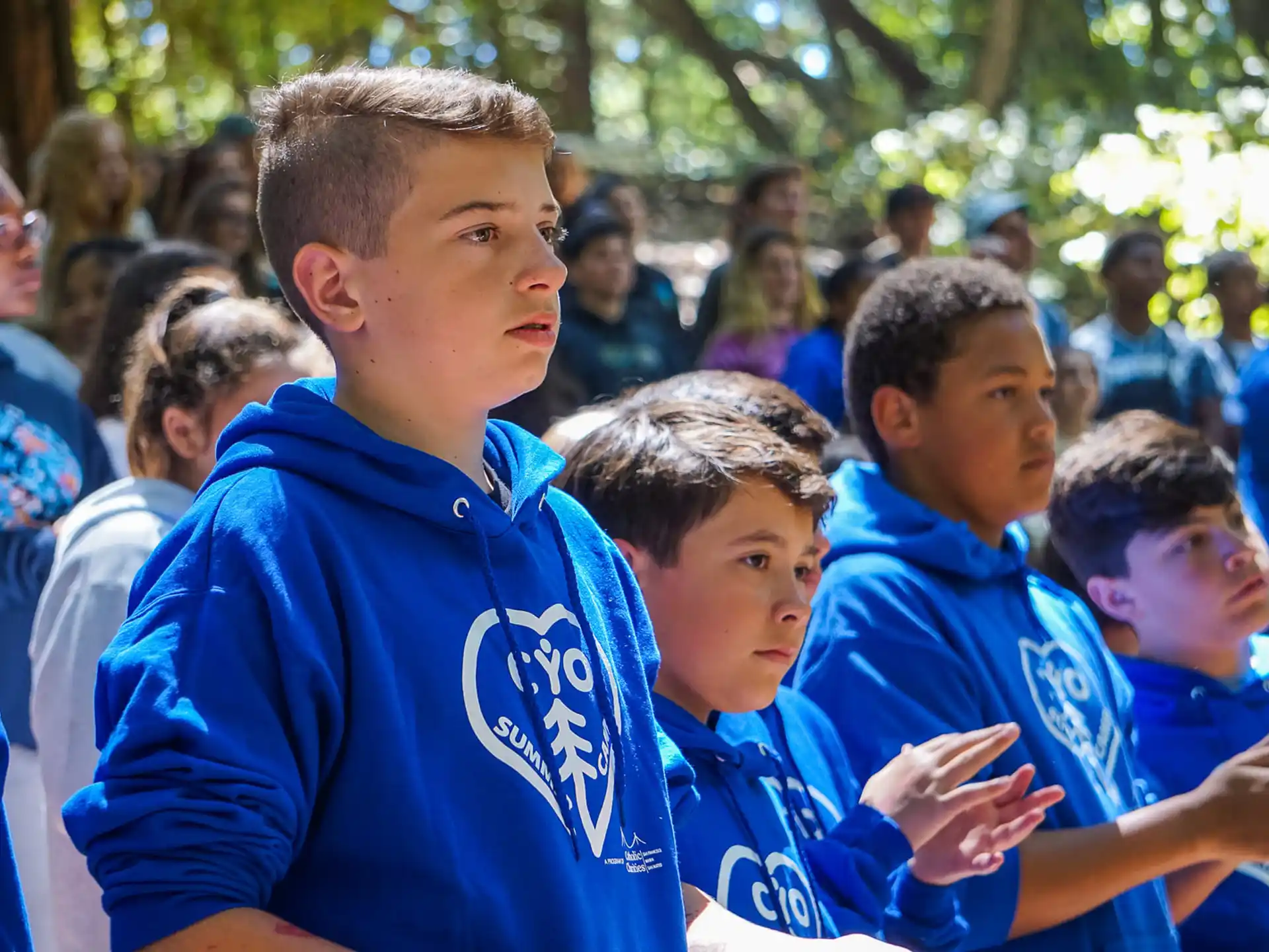 a group of boys in blue shirts