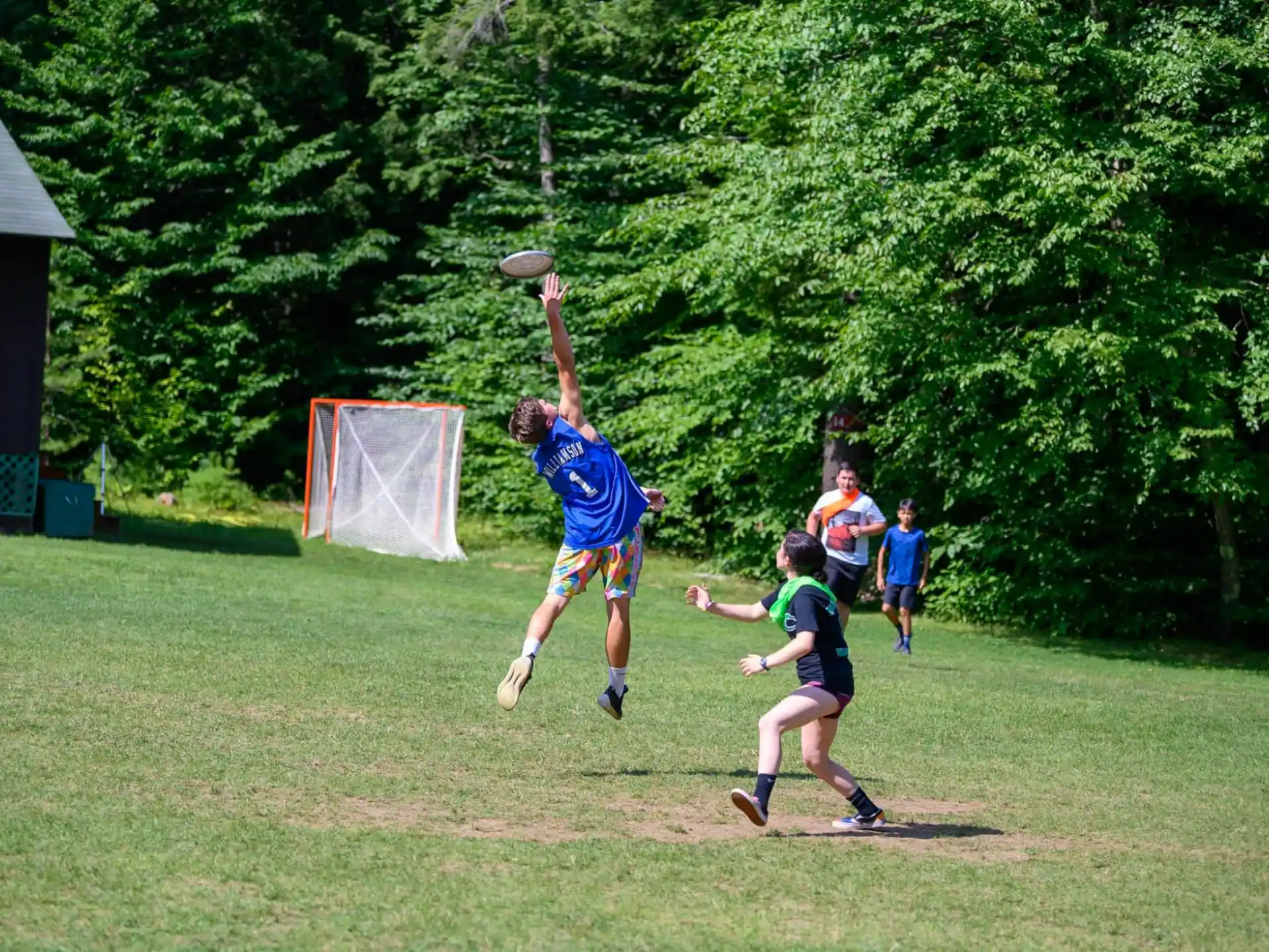 a group of people playing frisbee