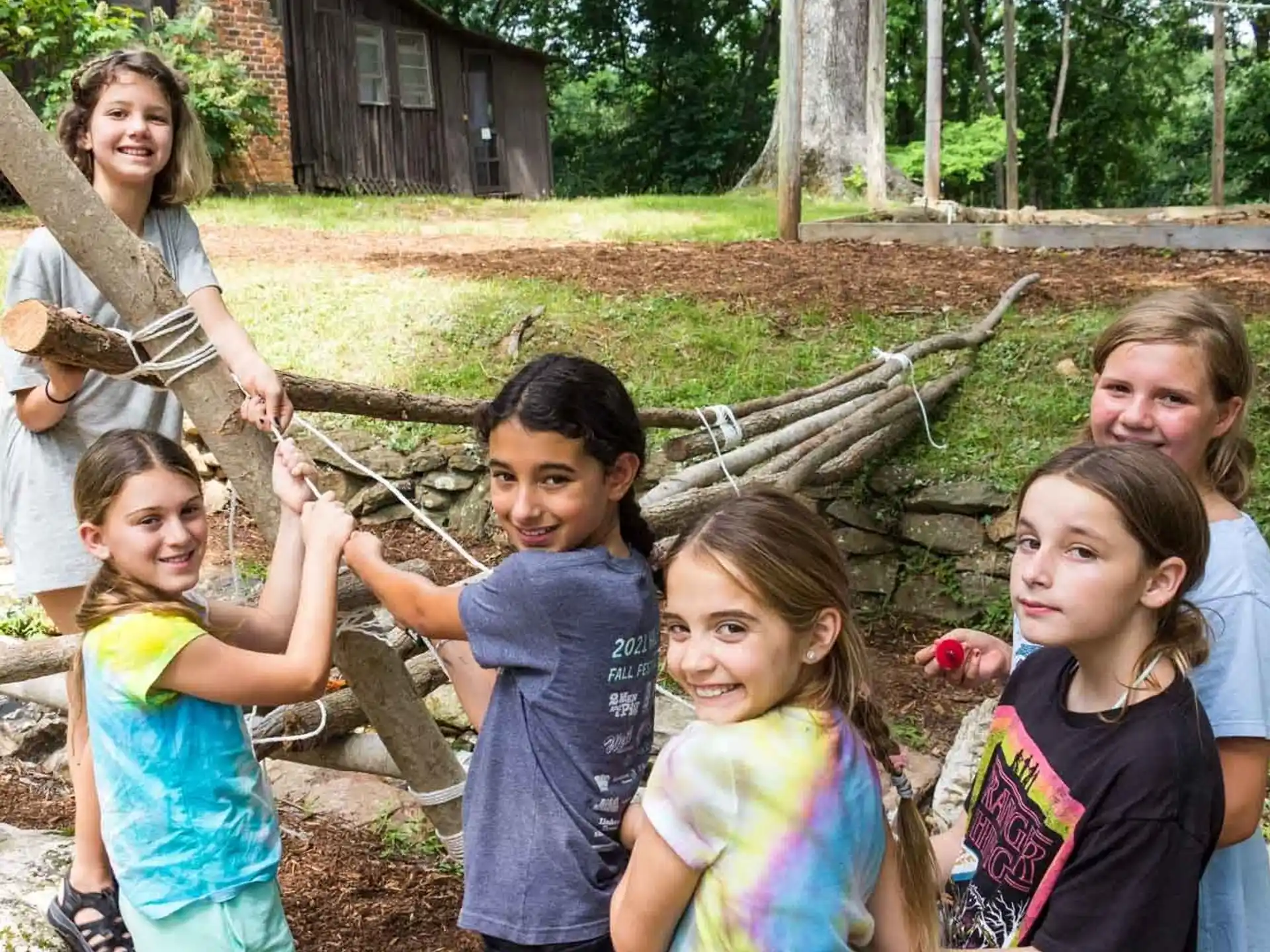 a group of children holding flowers