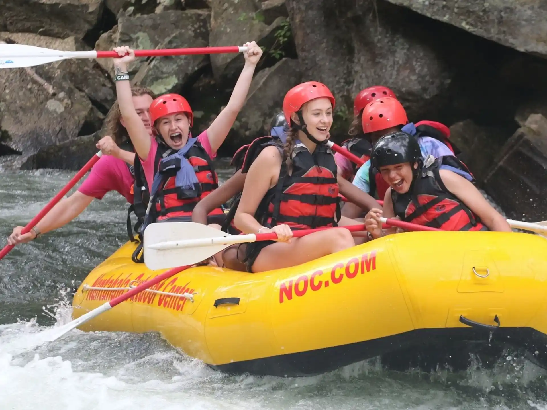 a group of people in a raft