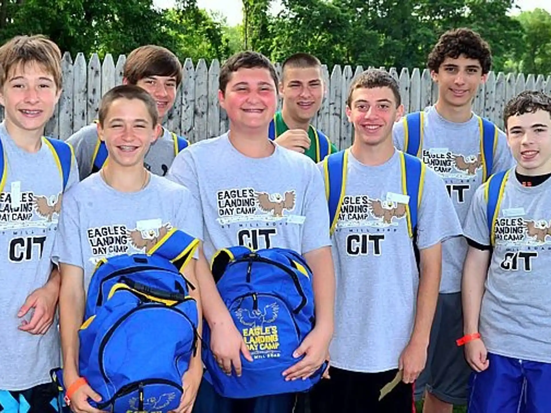 a group of boys wearing backpacks