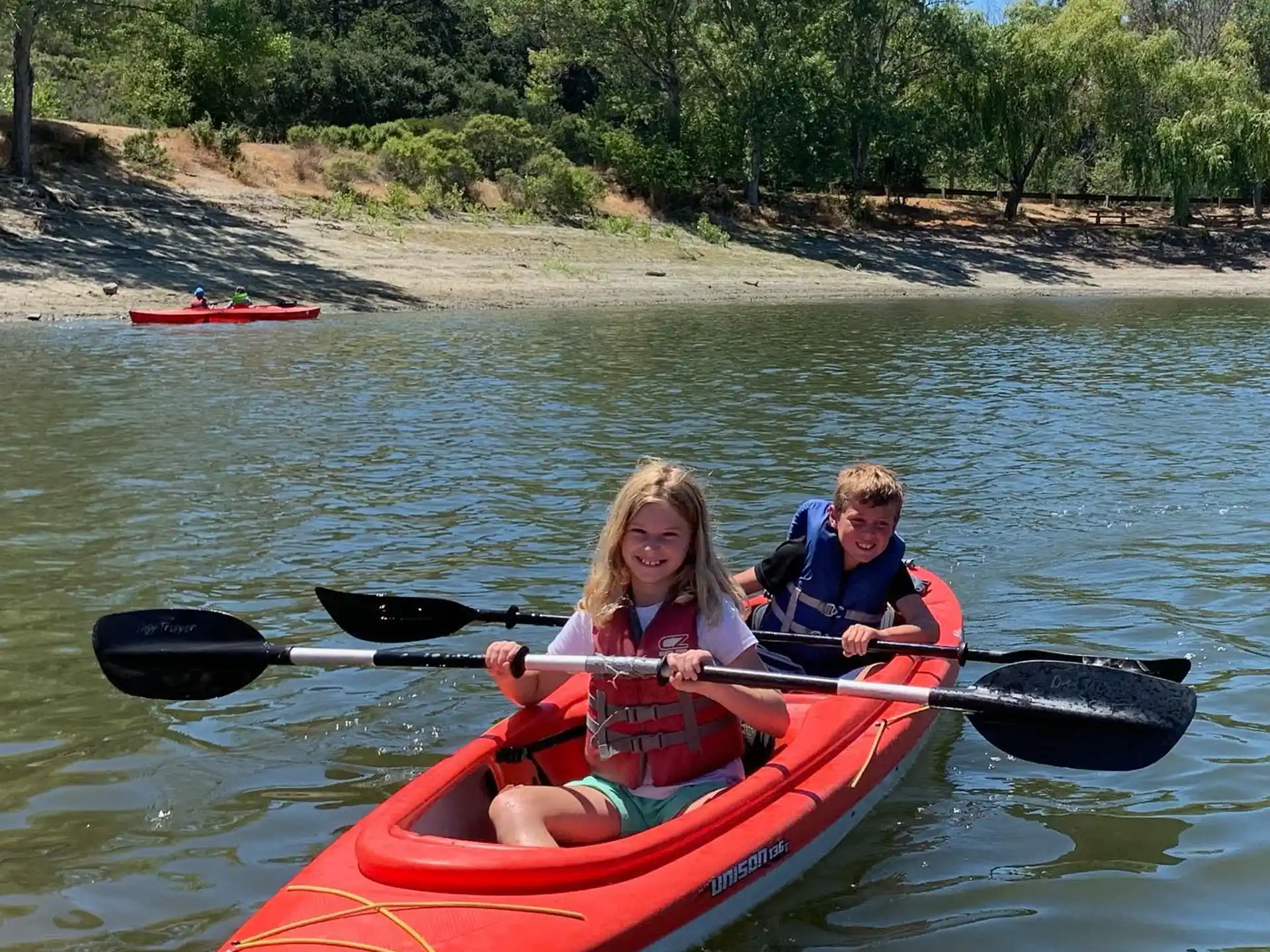 a couple of kids in a canoe