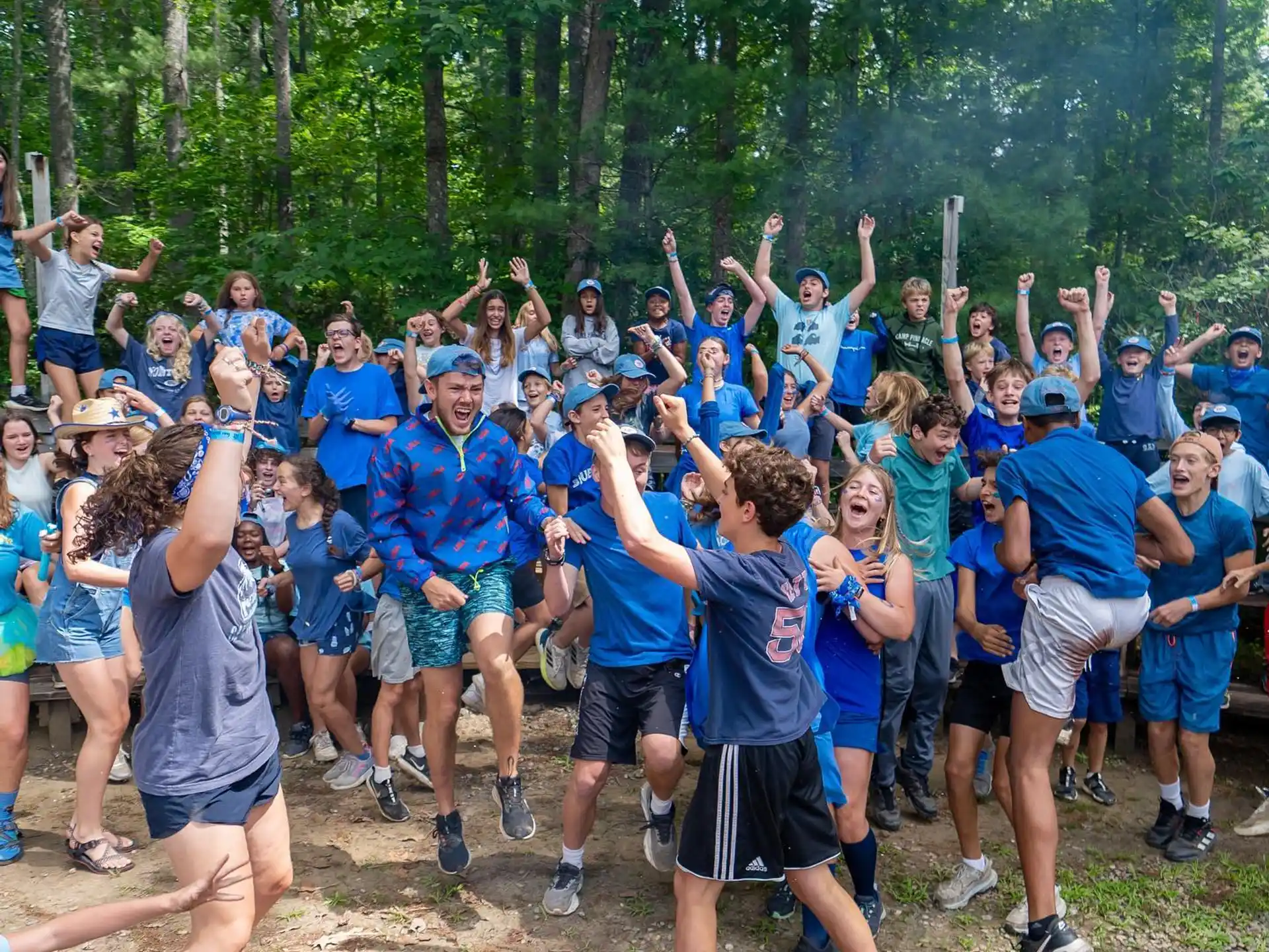 a group of people in blue shirts