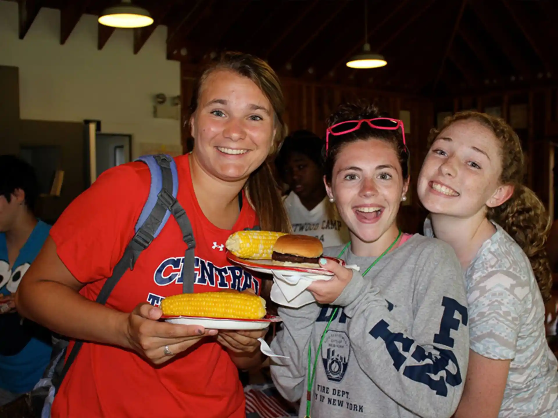a group of girls holding food