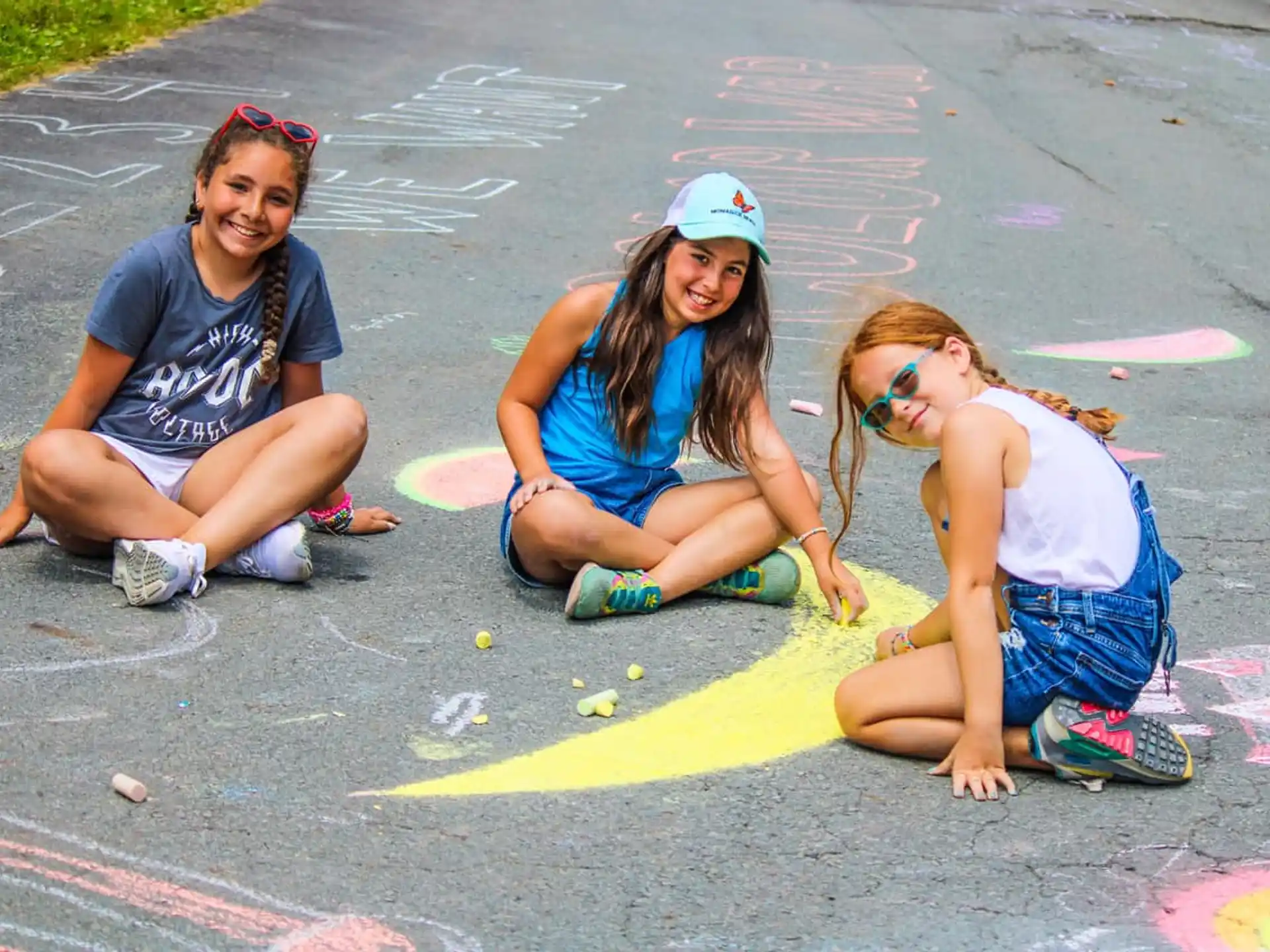 a group of girls kneeling on the ground