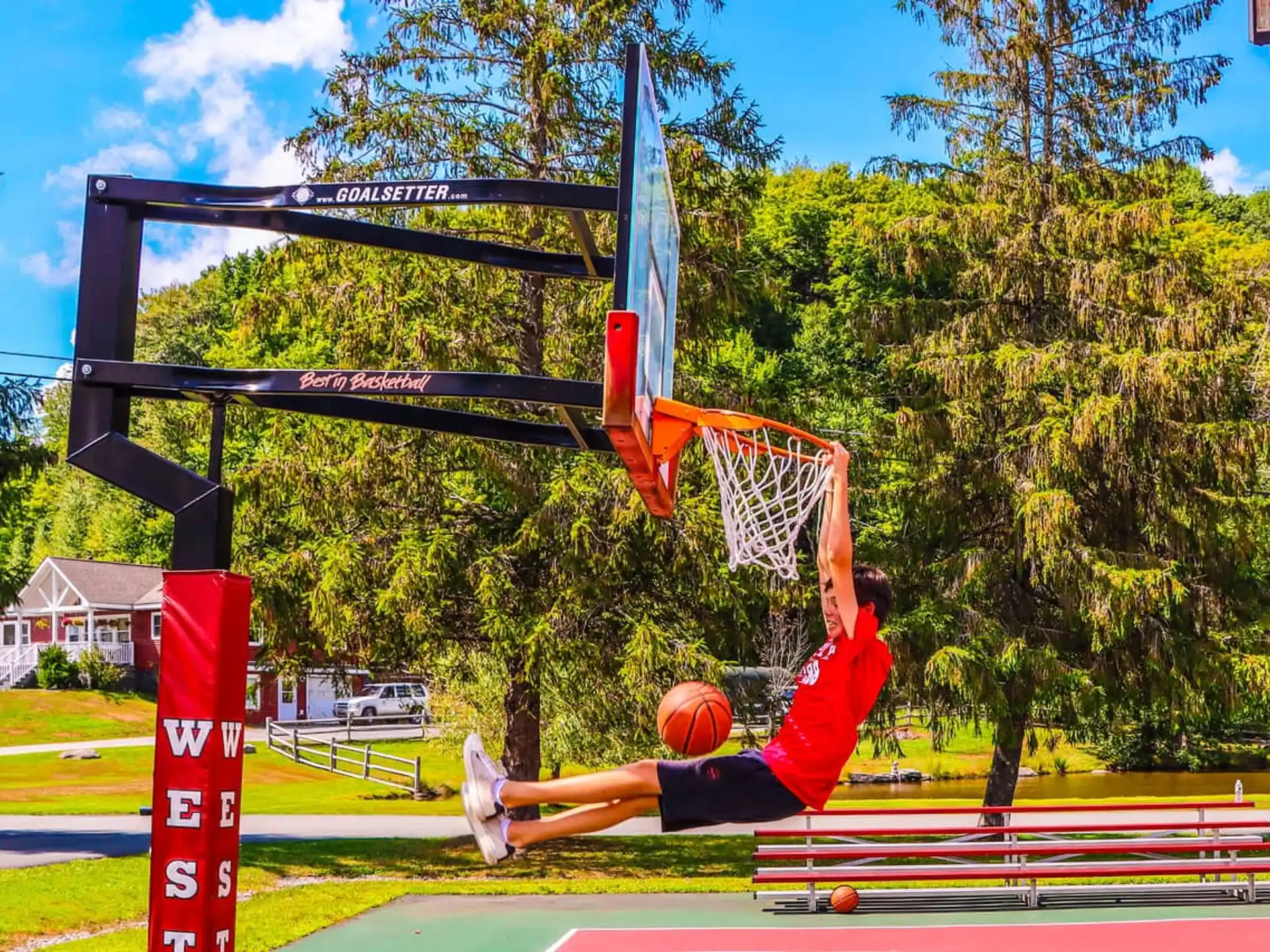 a person jumping to dunk a basketball
