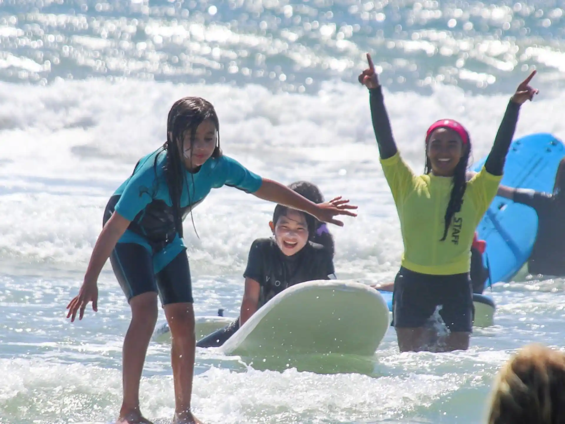 a group of people on surfboards