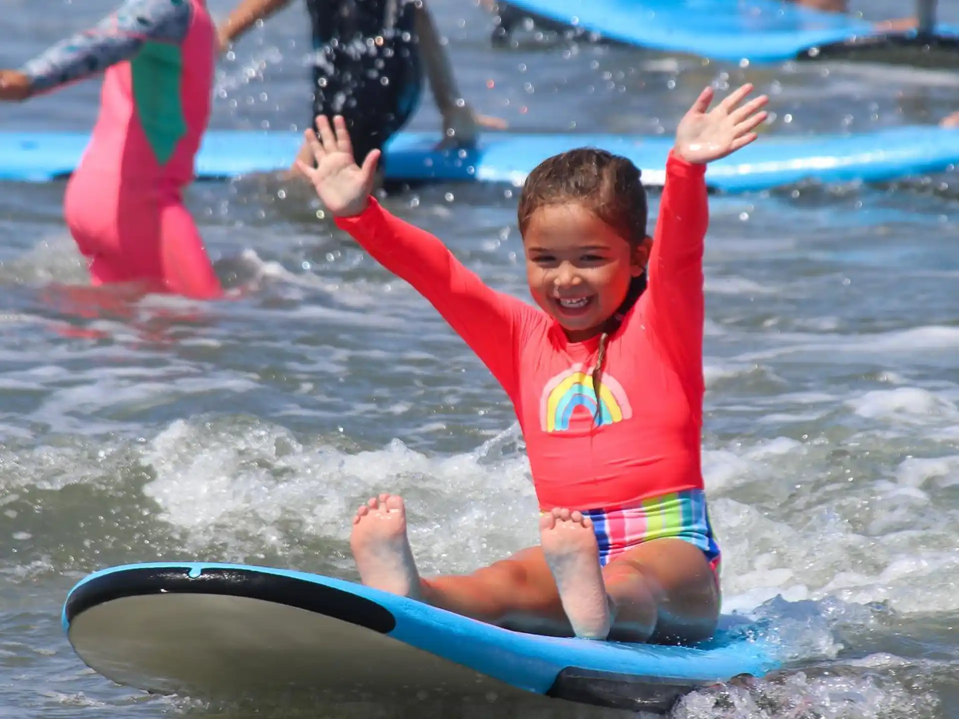 a kid riding a surfboard