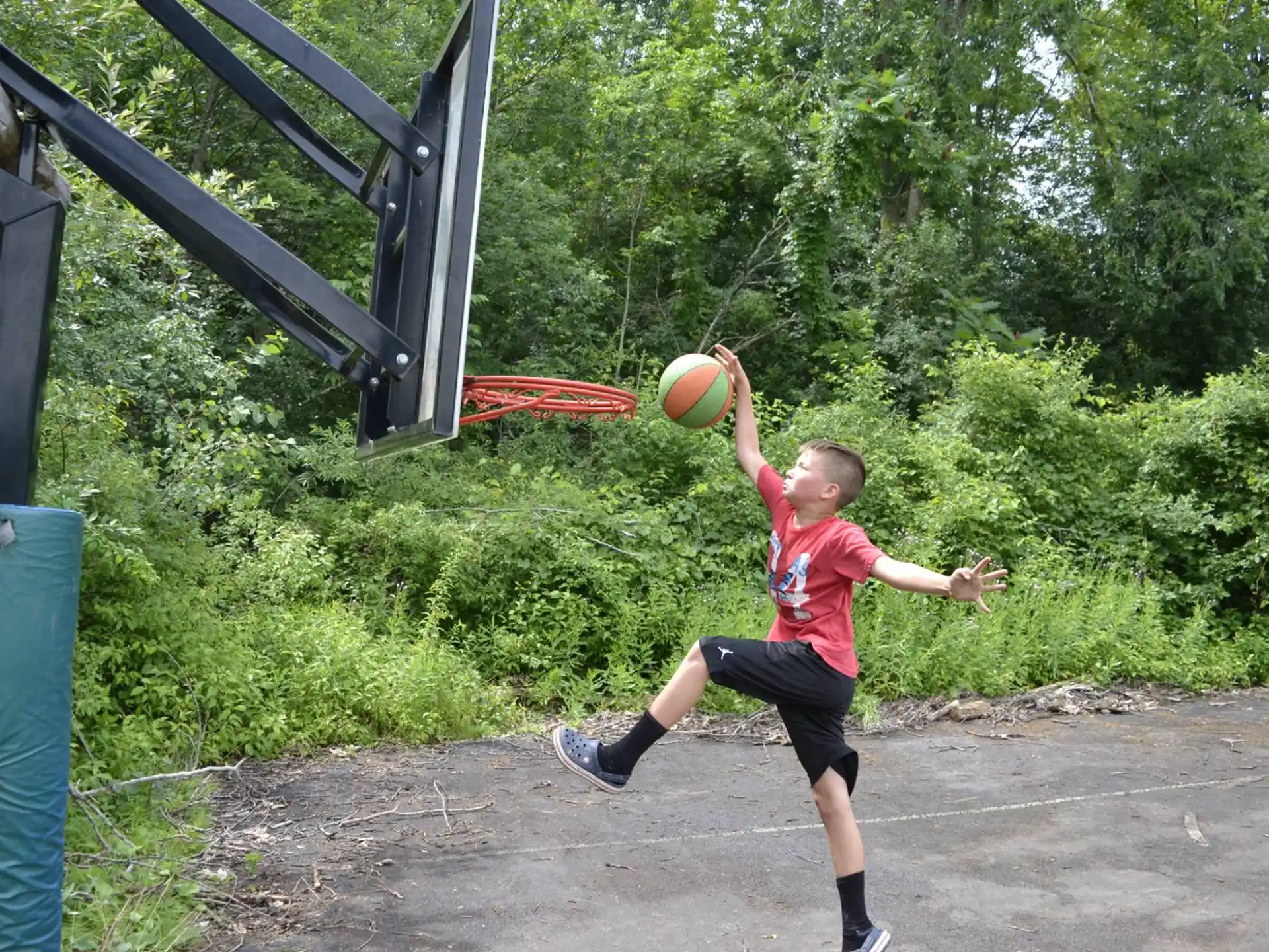 a boy playing with a ball