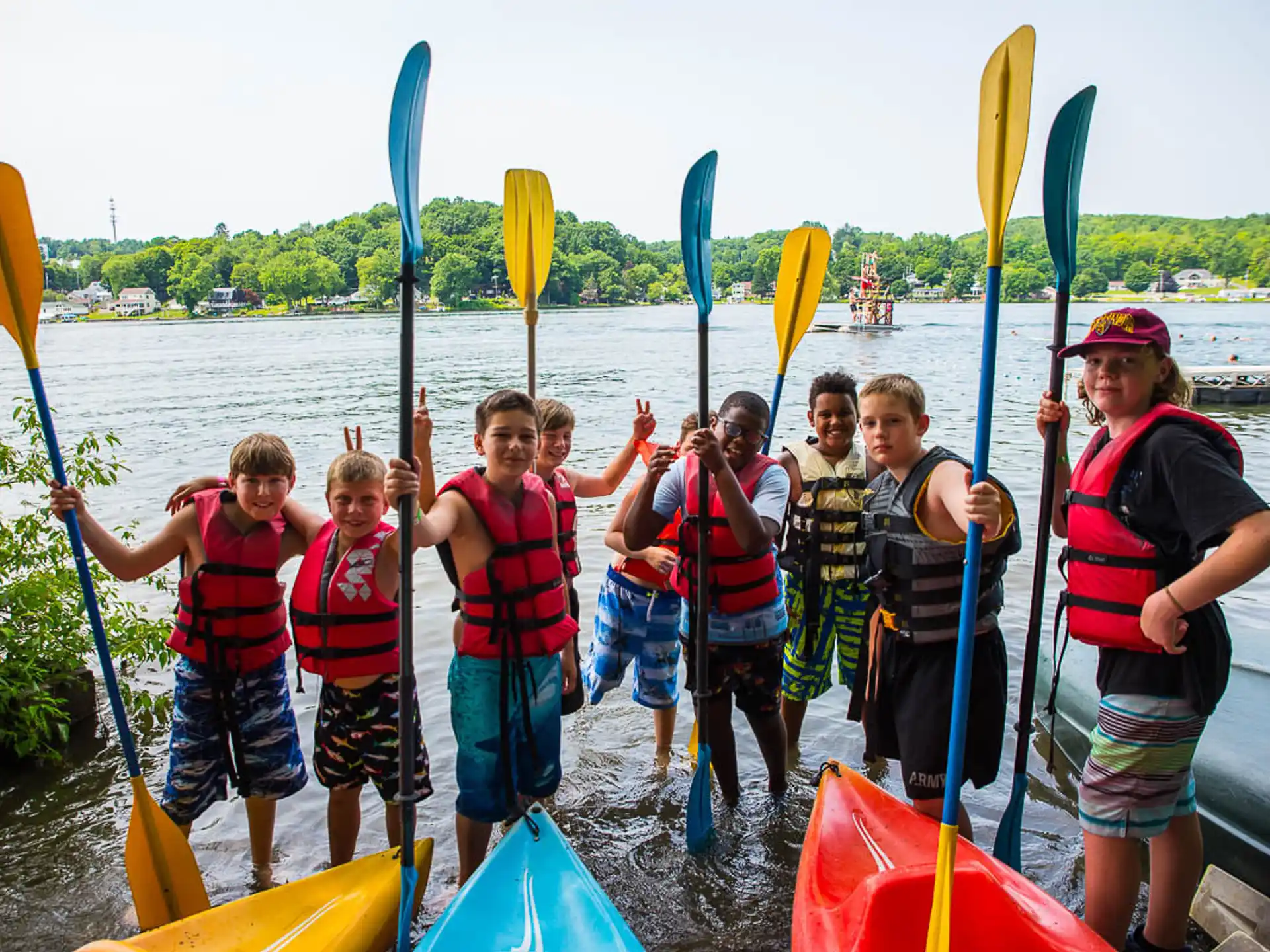 a group of people holding paddles