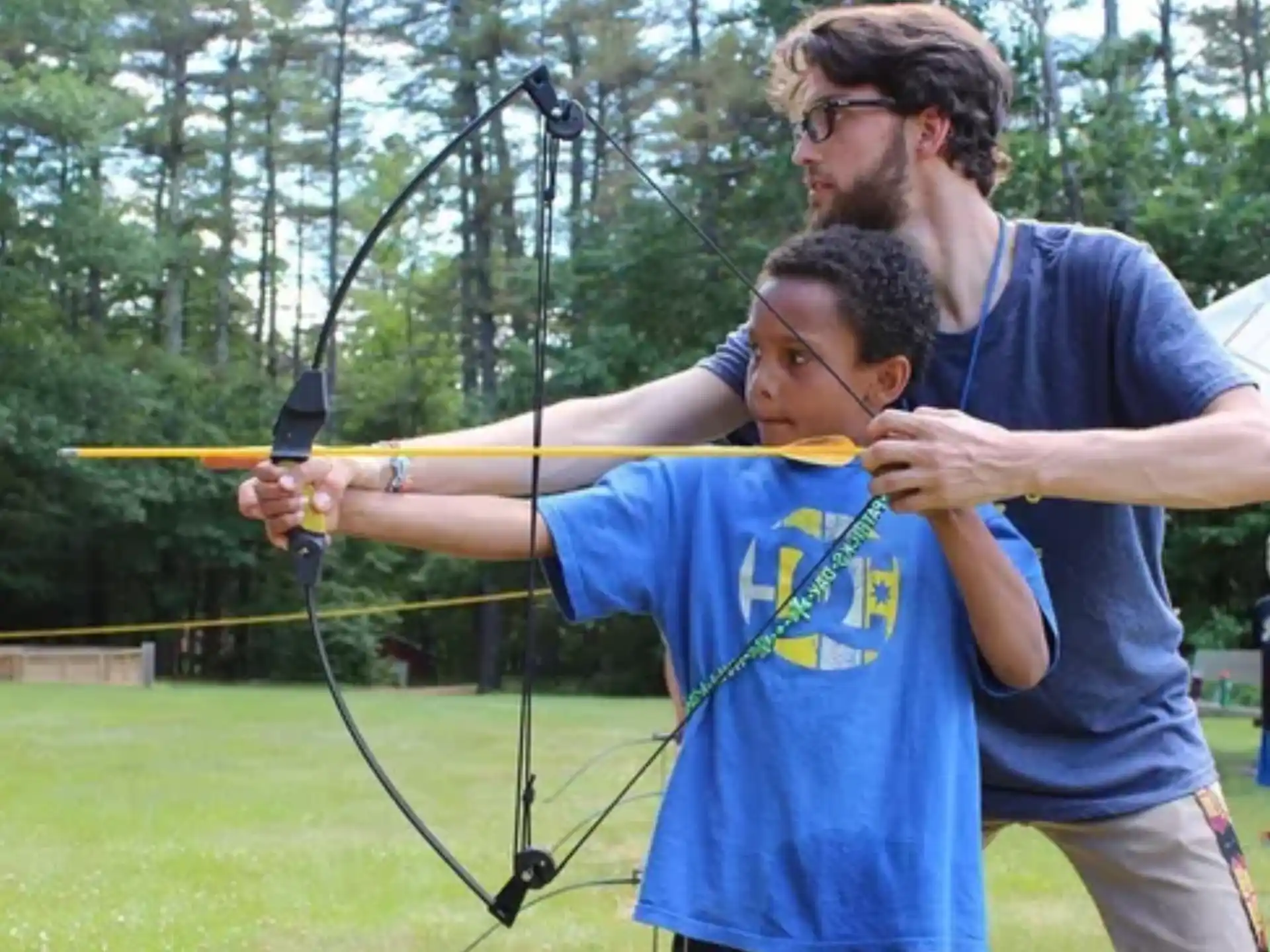 a man holding a bow and arrow