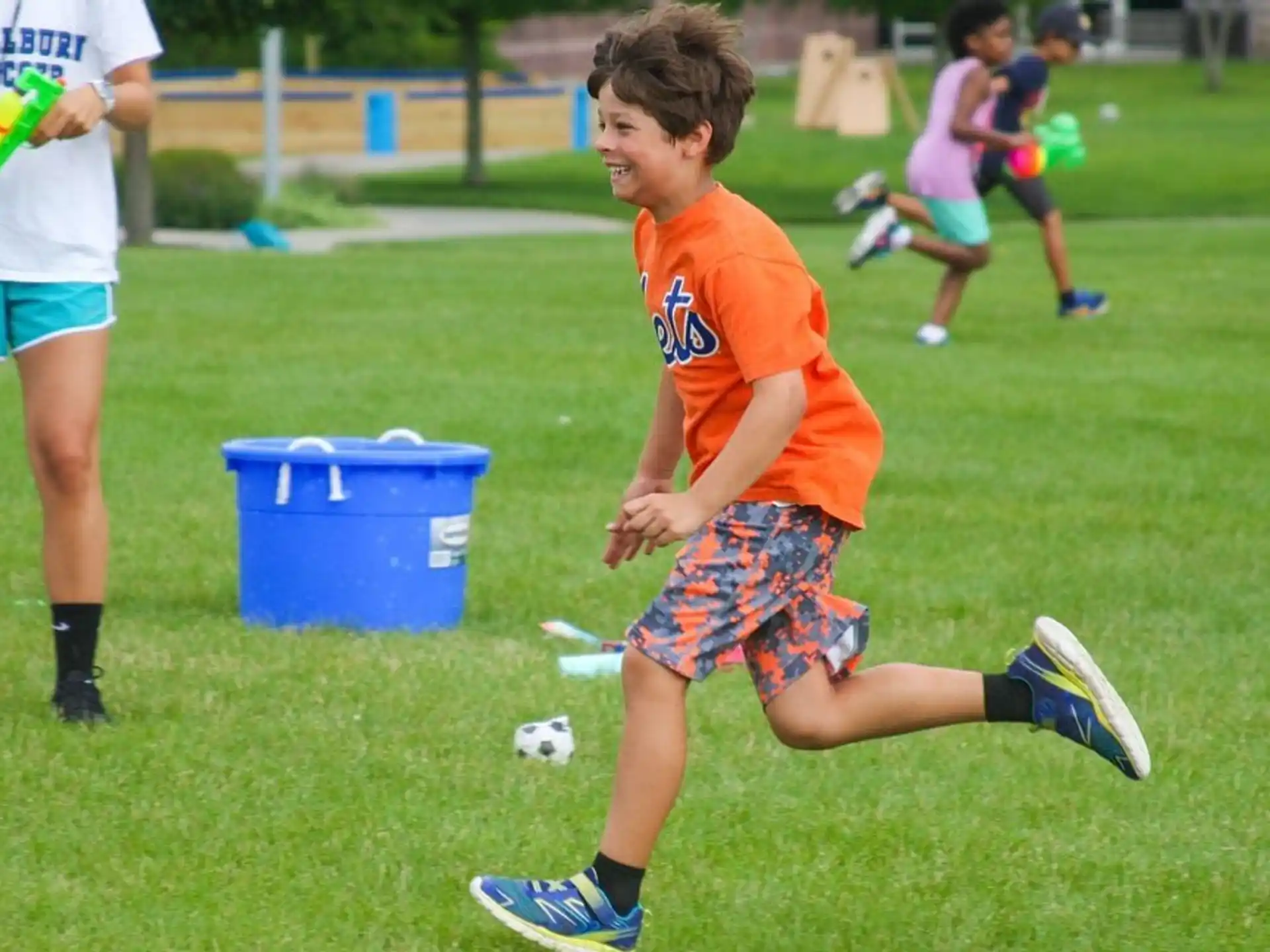 a boy running on a field