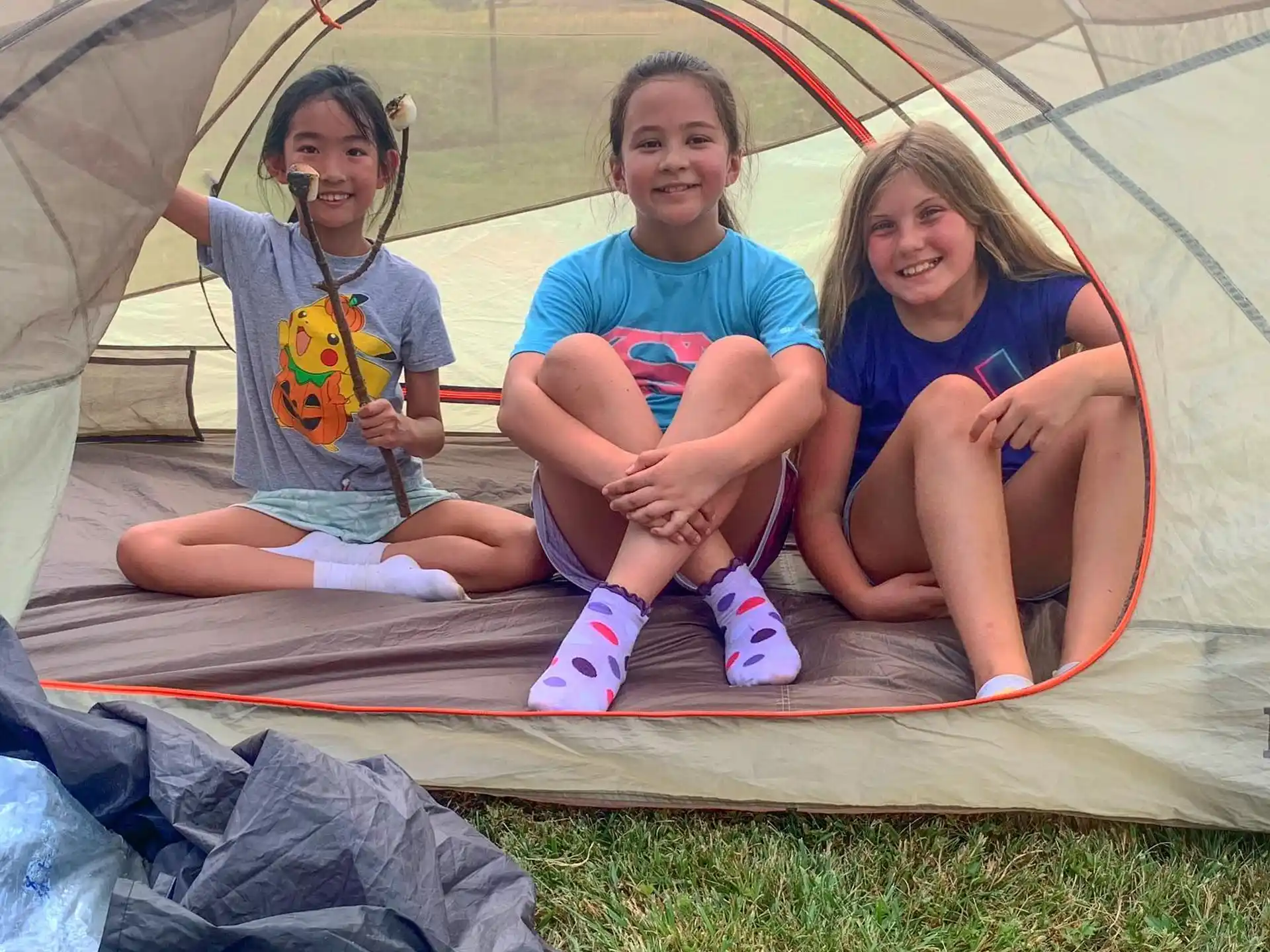 a group of people sitting in a tent