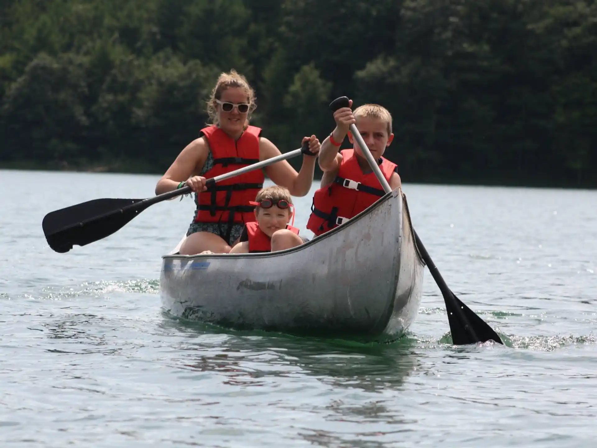 a group of people in a canoe