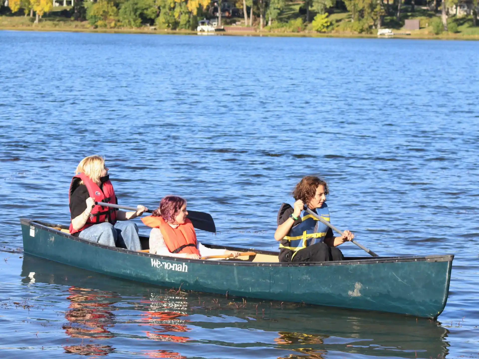 a group of people in a canoe