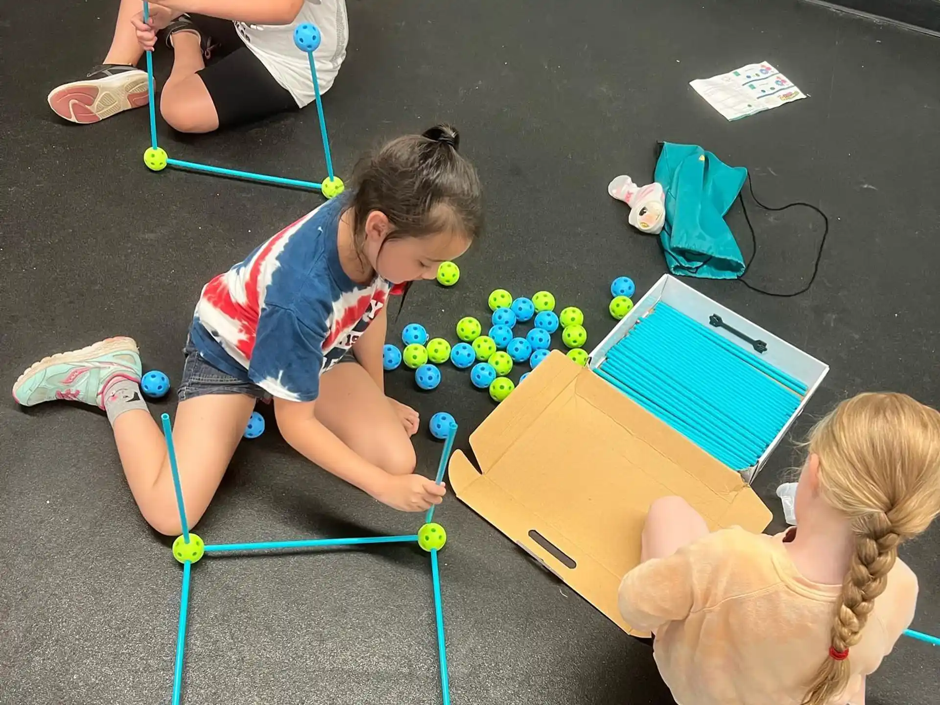 a group of children playing with balls