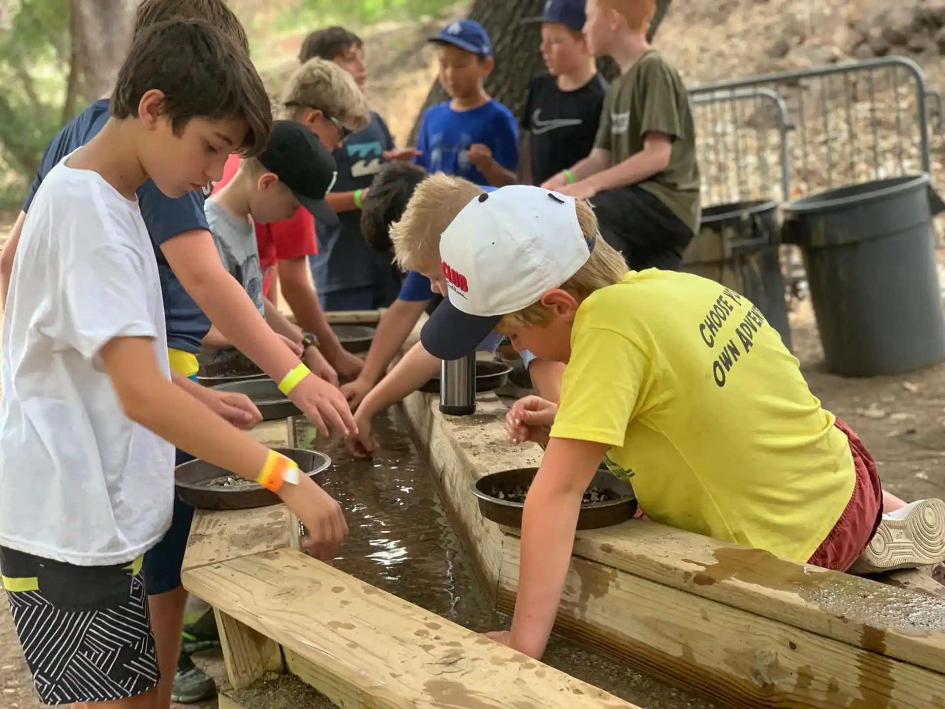 a group of people working on a water well