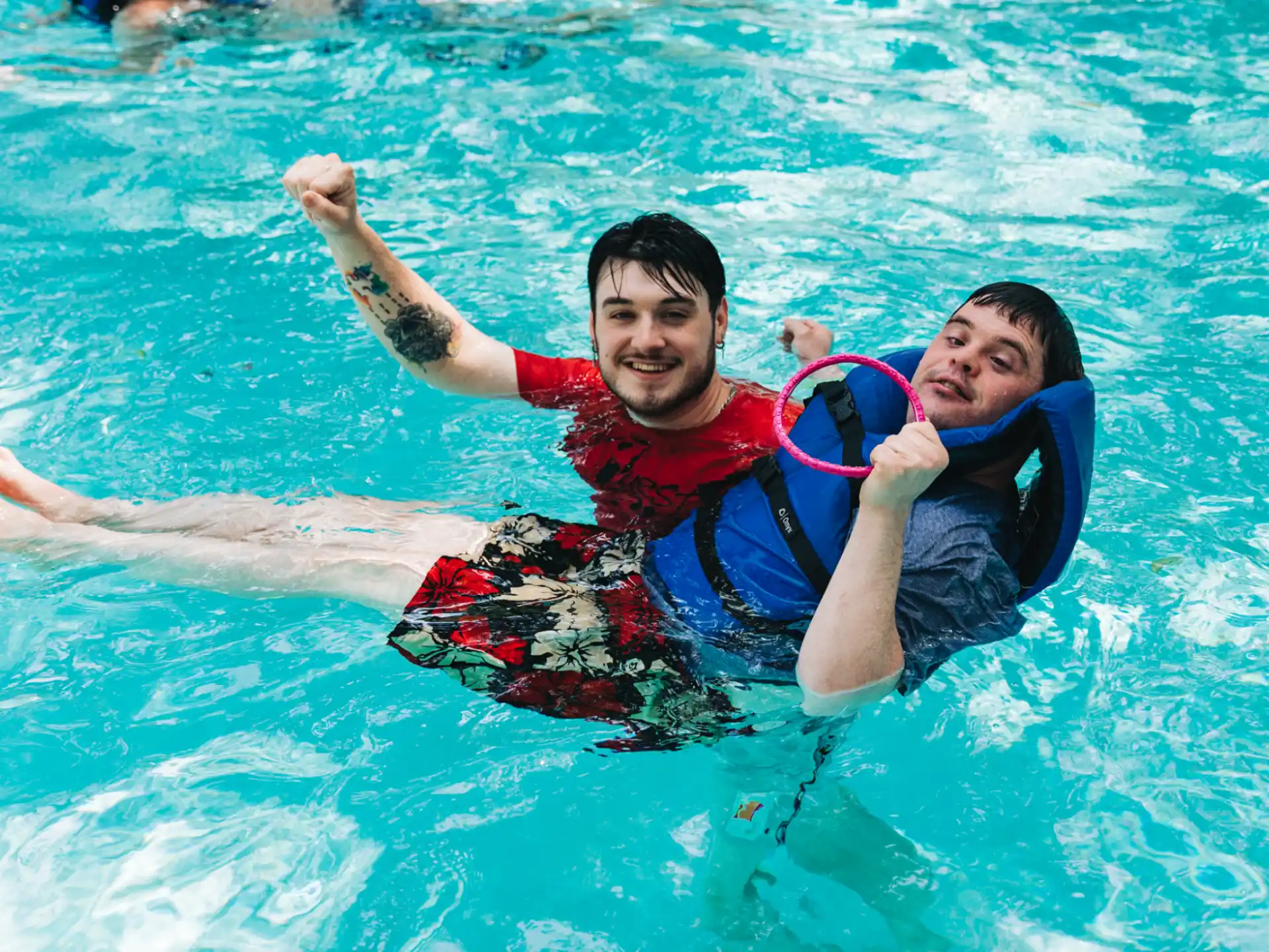 a couple of men in a pool