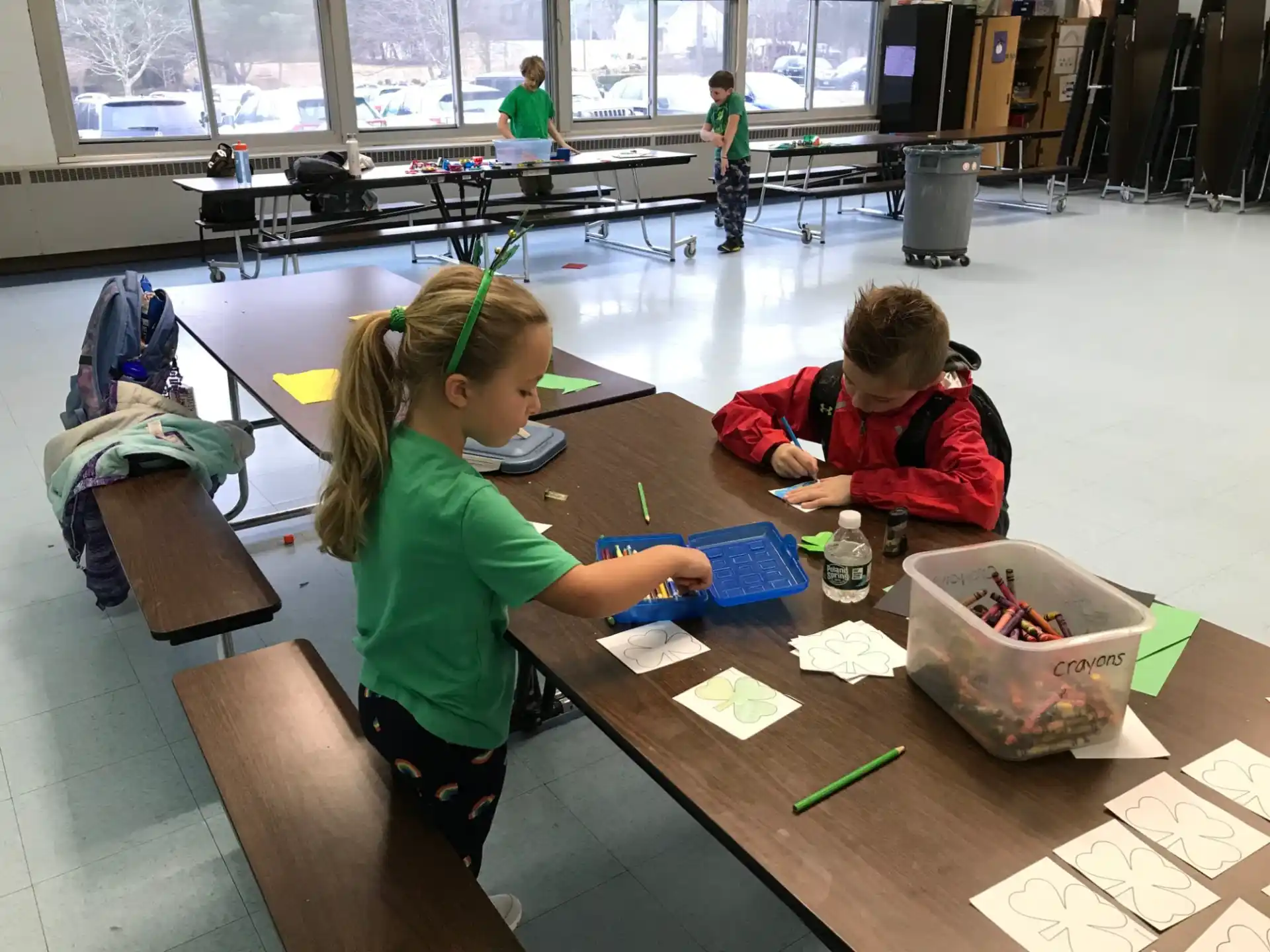 a few children painting on a table