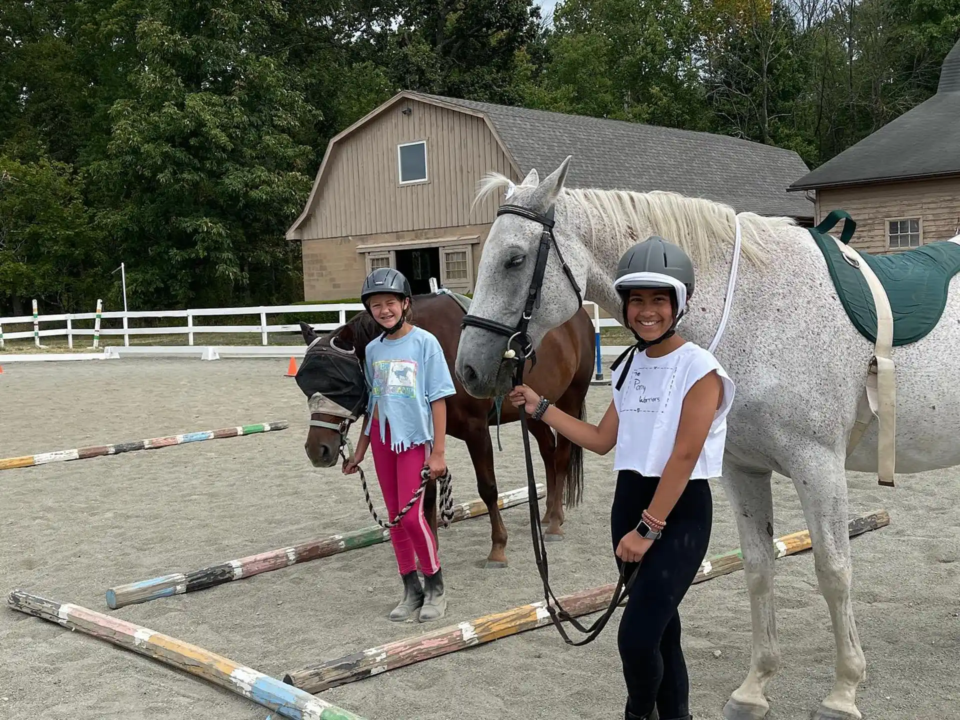 a couple of people with horses