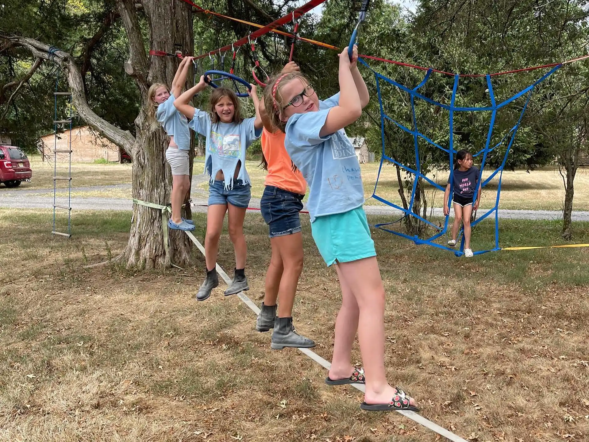 a group of people playing on a swing set