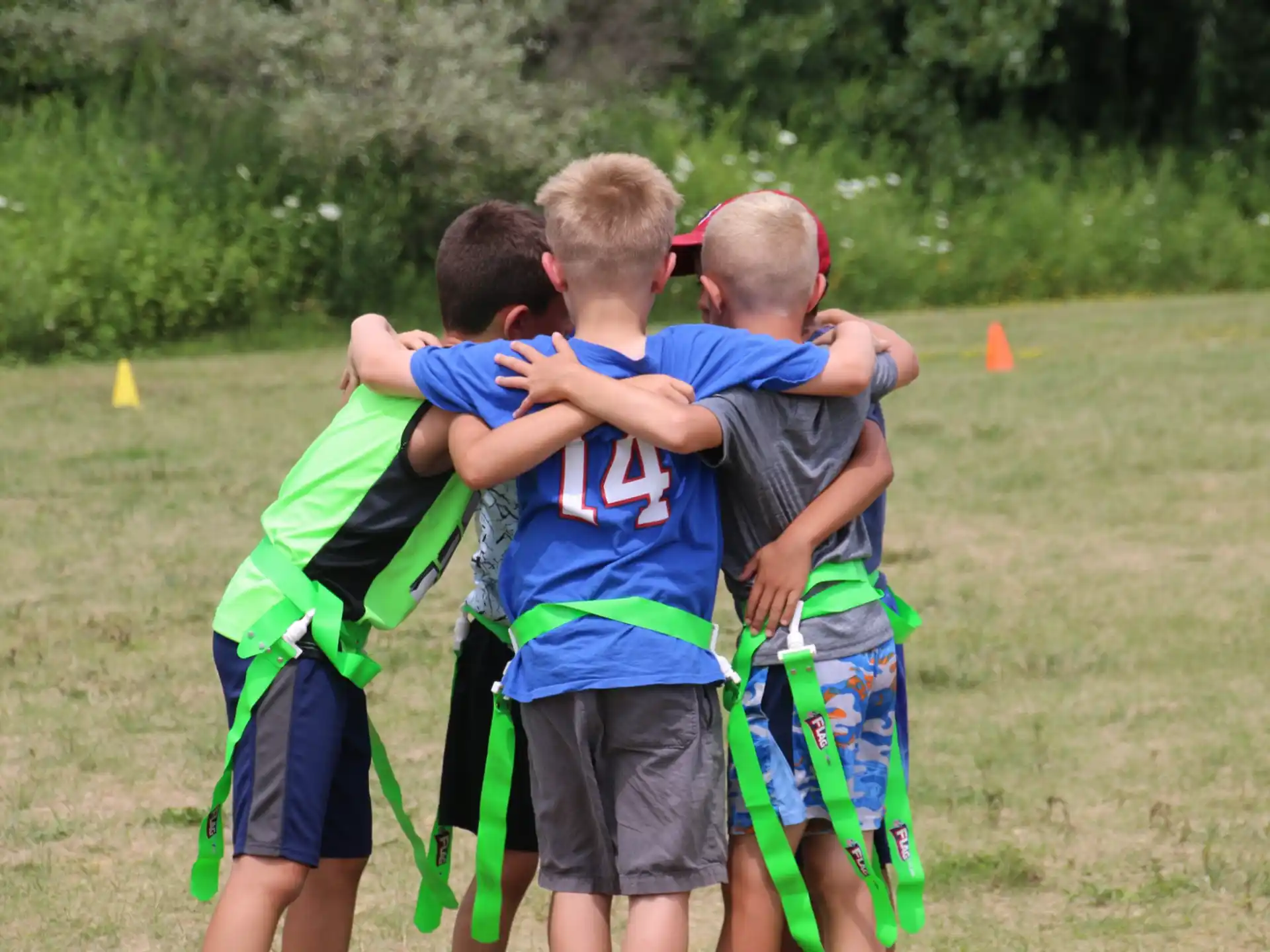 a group of boys hugging