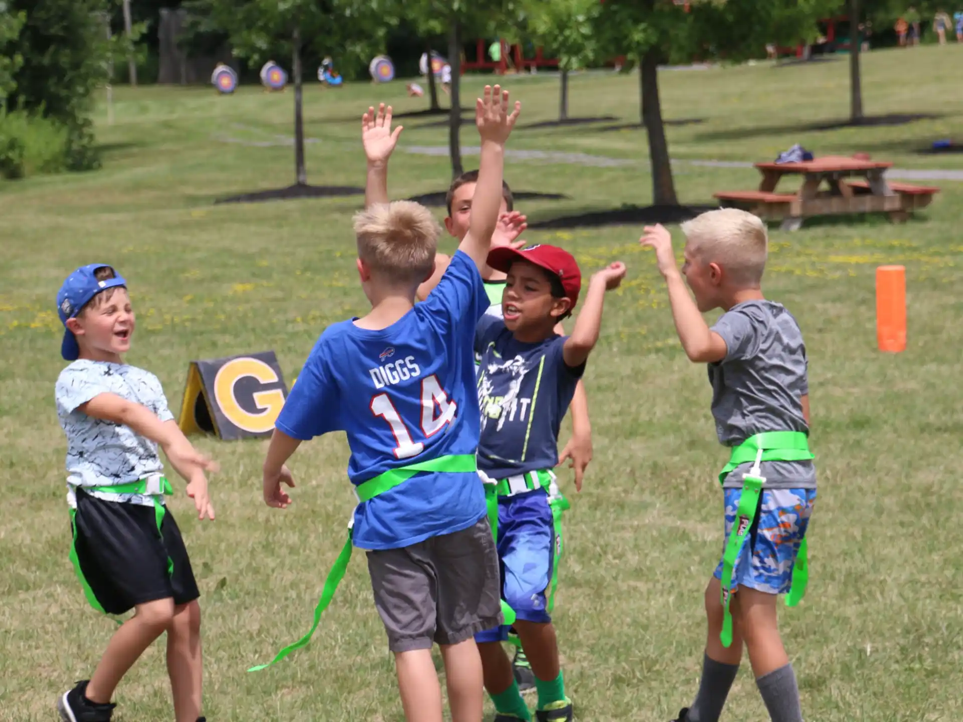 a group of boys playing with a frisbee