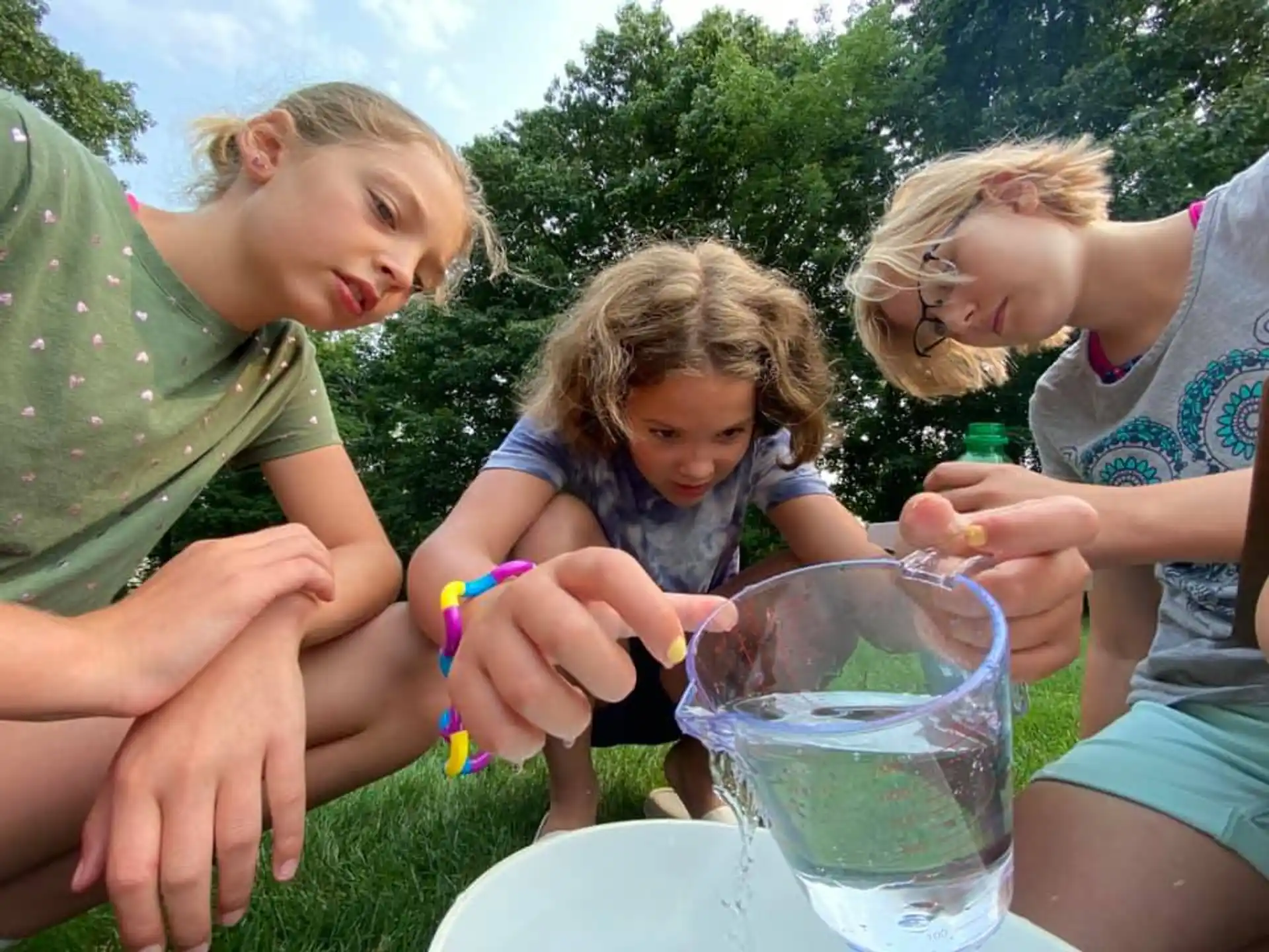 a group of people playing with a toy