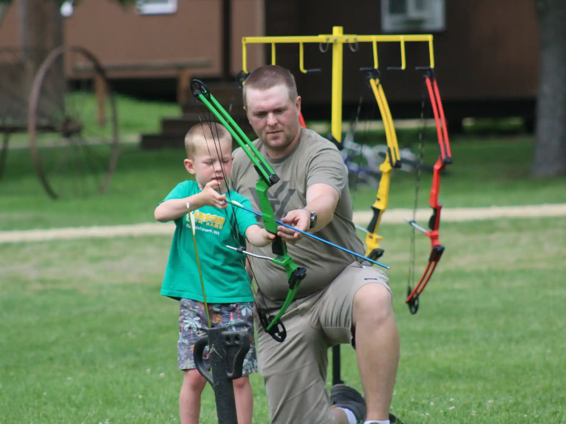a person and a boy playing with a toy