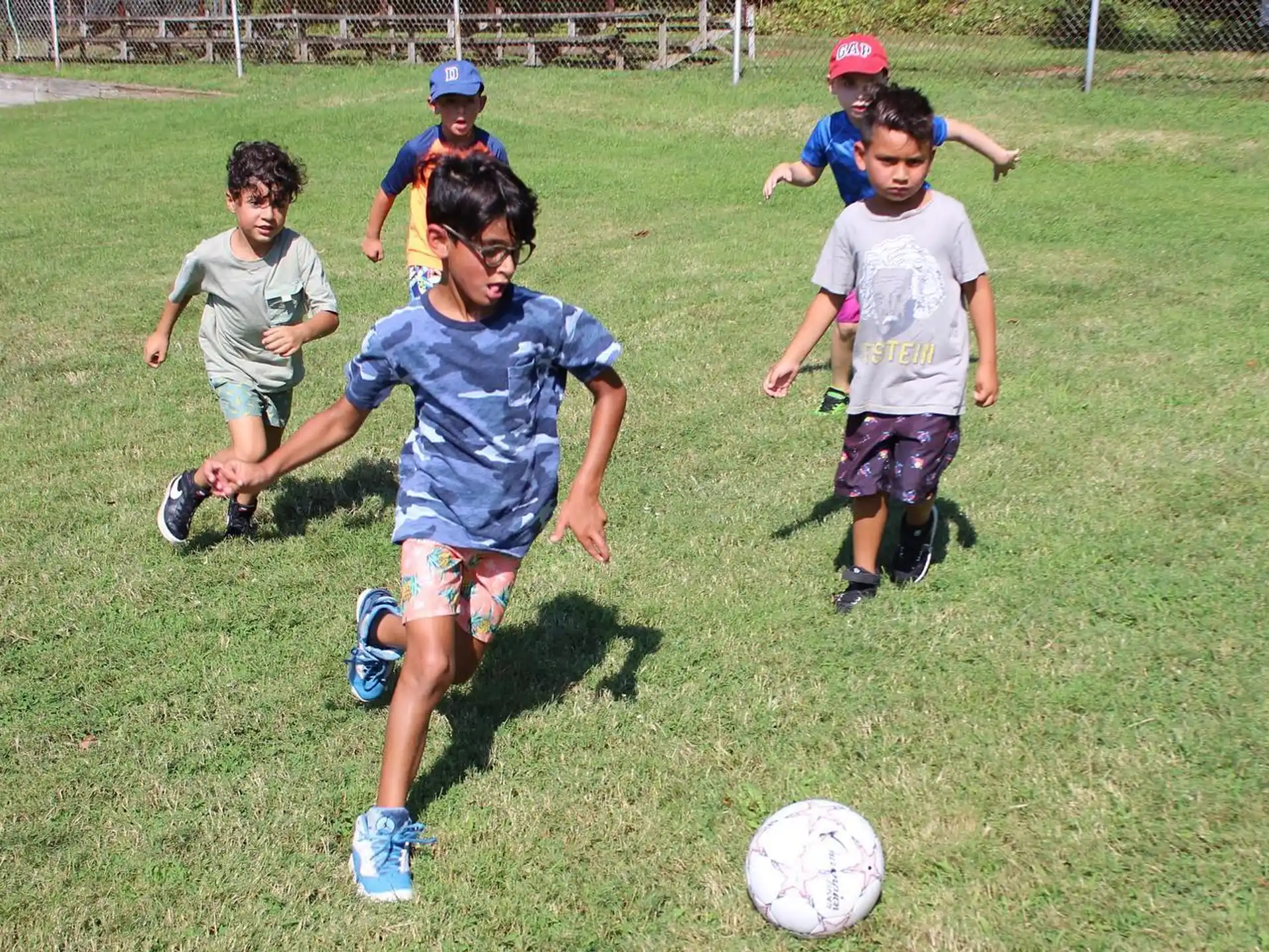 kids playing with a football ball